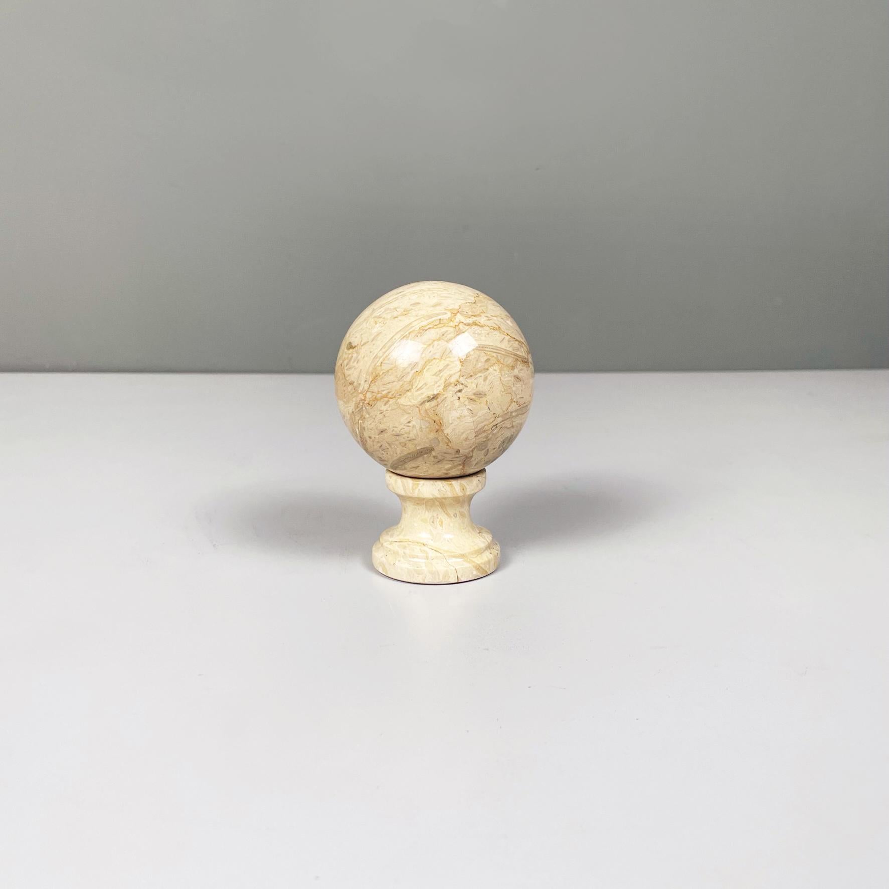 Italian midcentury Geometric spherical sculpture in beige onyx stone, 1960s
Geometric sculpture in light brown-beige onyx stone, composed of a sphere resting on a small round base.
1960s.
Very good conditions, it has a defect on the base.