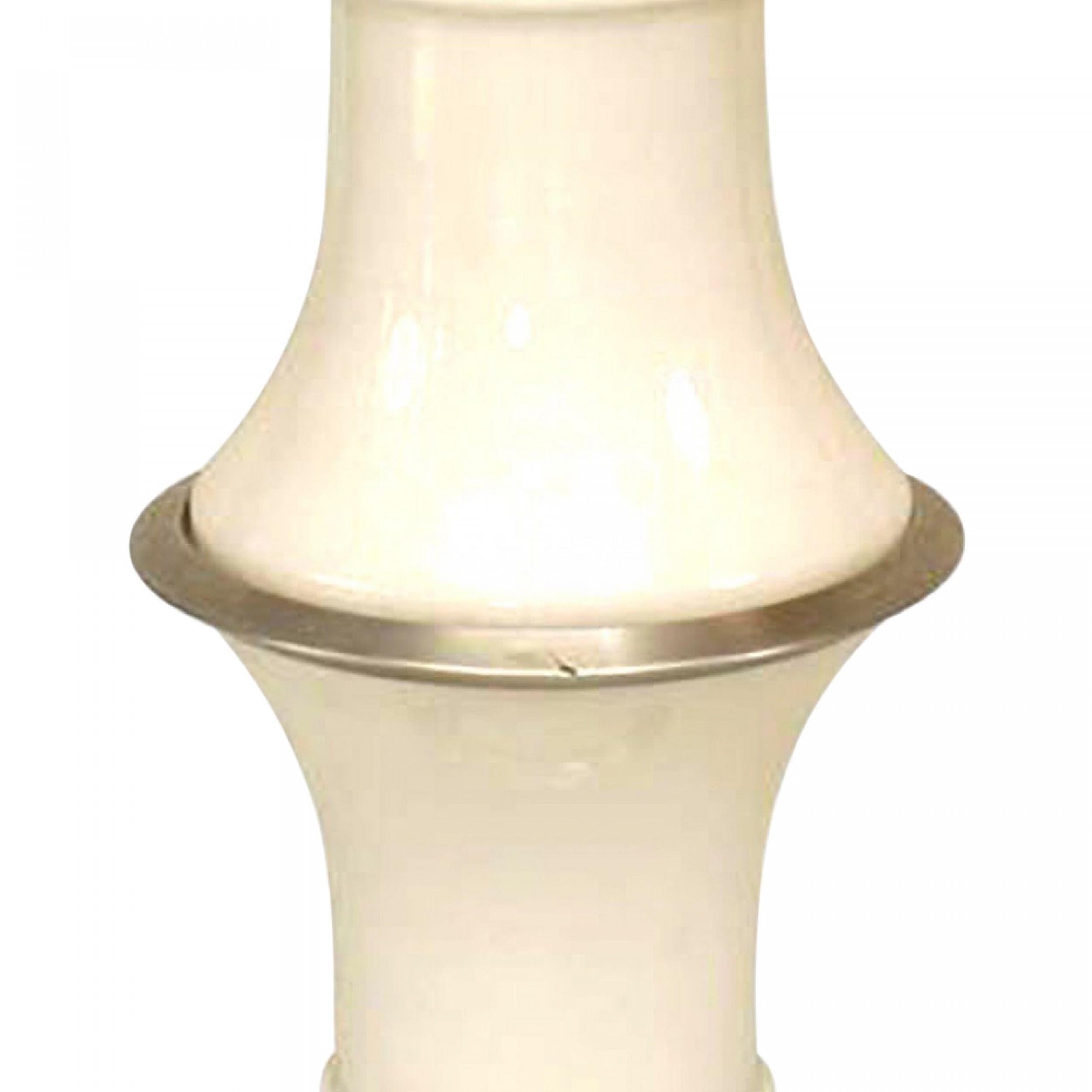 Italian Post-War Design (1960s) low floor lamp with 2 white glass sections separated by aluminum fittings with an aluminum base and round top cover.
