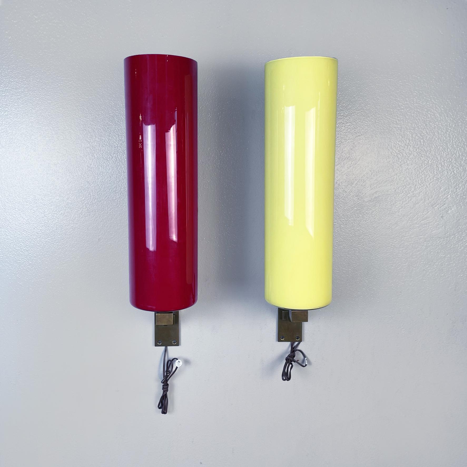 Italian mid-century glass and brass applique, attributed to Carlo Mollino, possibly made by Colli, circa 1960
Set of four colored wall lamps with brass structure and cylindrical glass lampshade. There are two lamps in red, one in yellow and one in