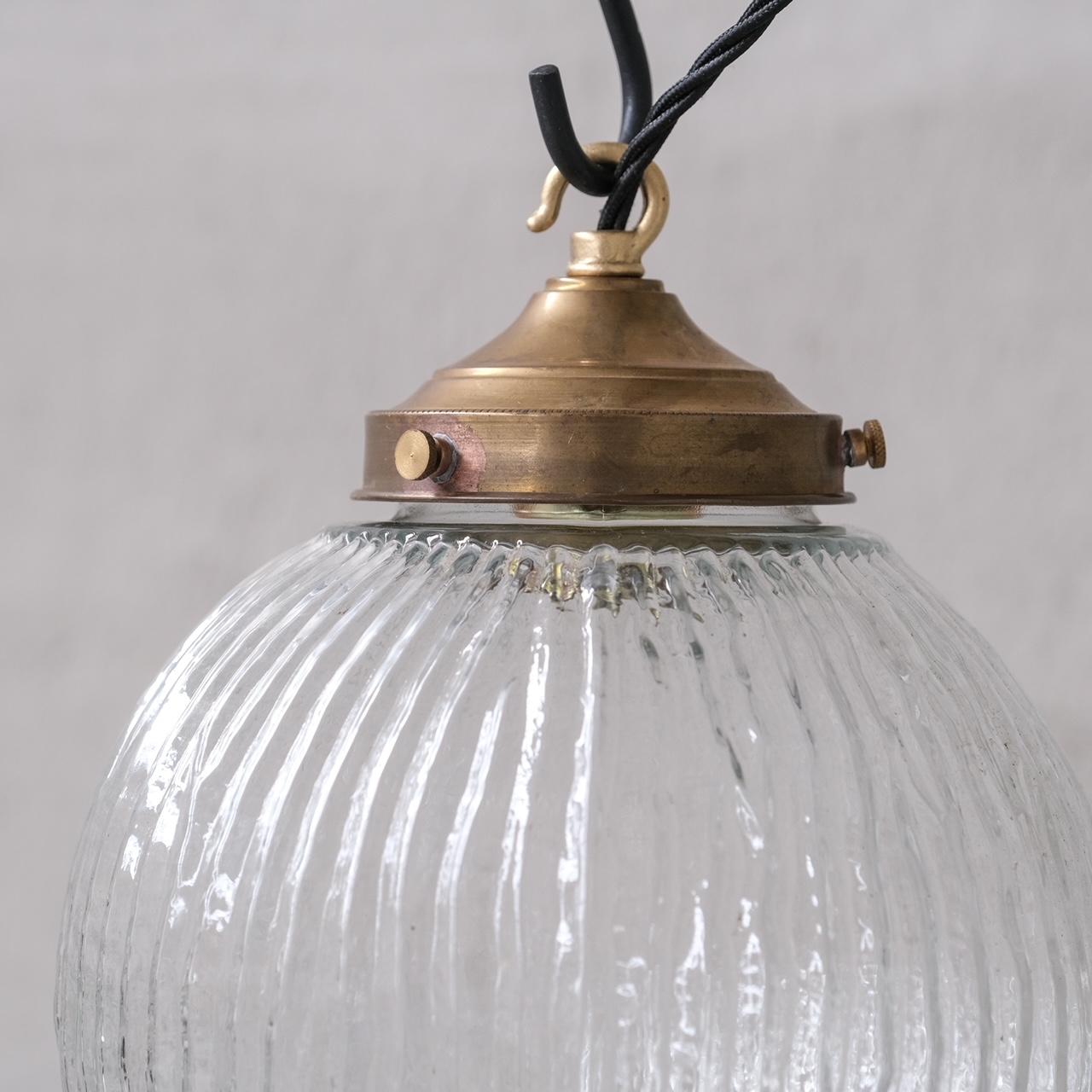 A stylish single pendant light. 

Italy, c1970s. 

Unusual stripped/veined finish. 

Naturally patinated brass gallery. 

No rose was retained or chain, however they are easy to source online. 

Good vintage condtion, re-wired and PAT