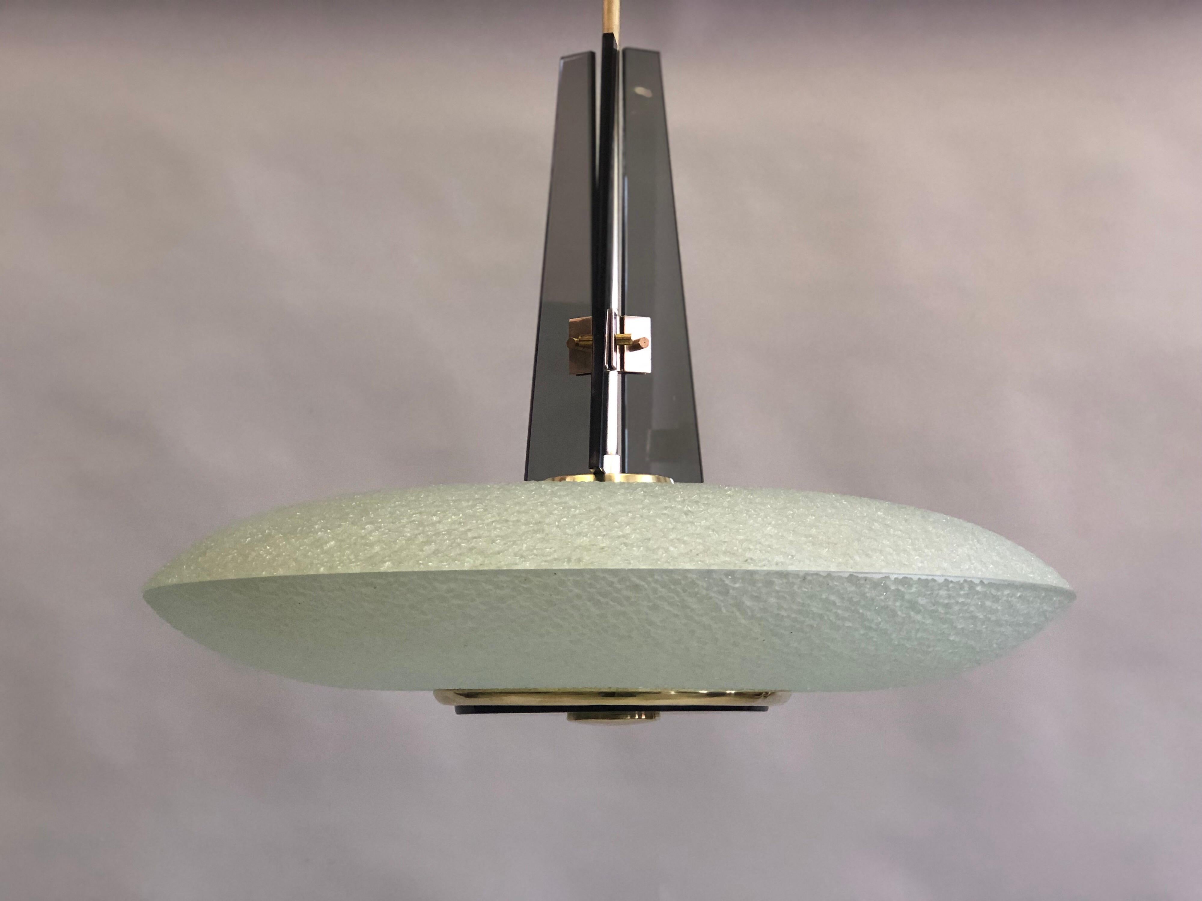 Rare Italian Mid-Century Modern chandelier / pendant / fixture by Max Ingrand for Fontana Arte in double saucer form with opaque, satin green glass in a textured pattern. A 3 part tapered grey glass finial with solid brass fittings completes the
