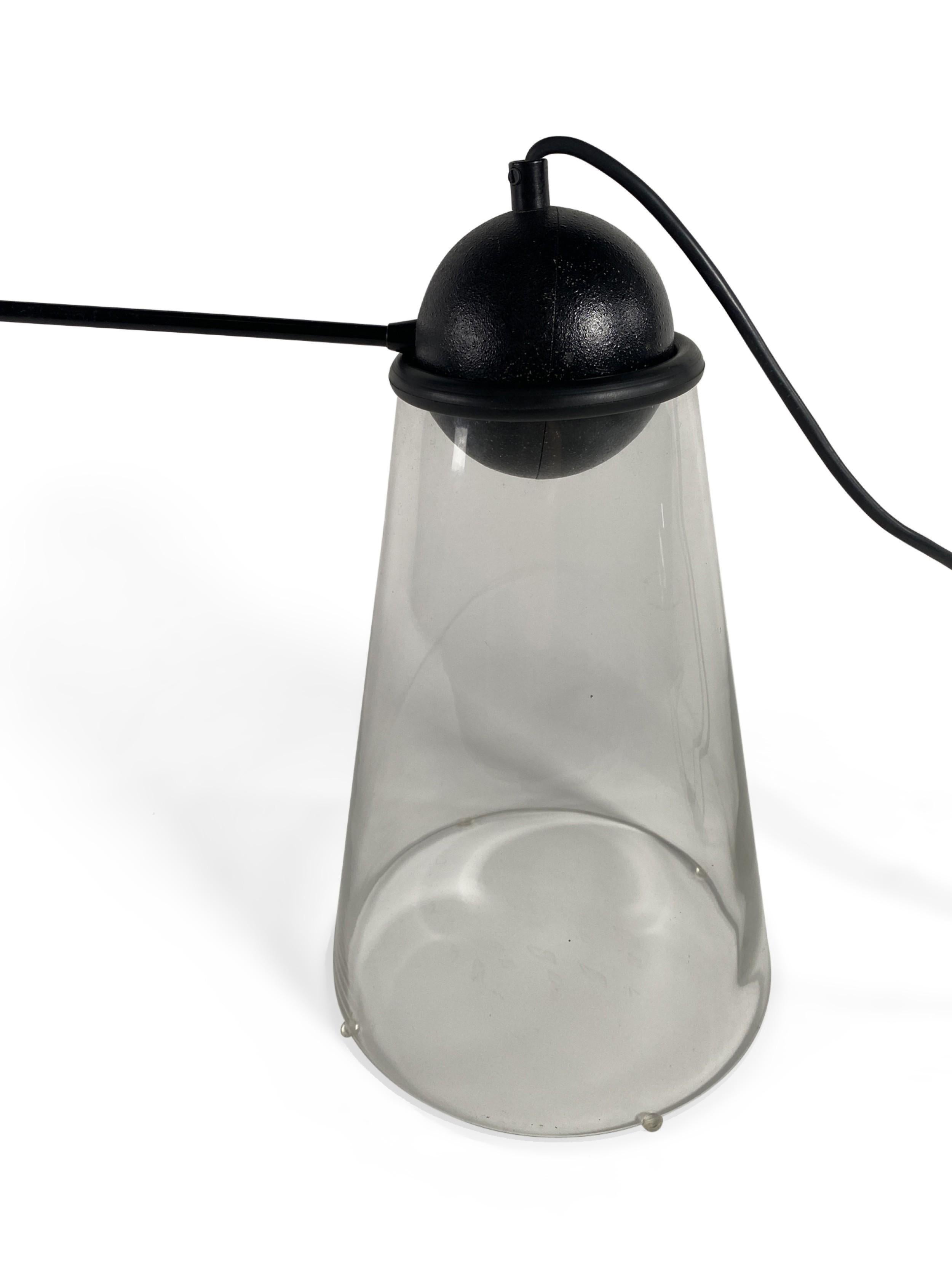 Italian Mid-Century desk lamp with a black pivoting steel ball and glass cone base with a black steel fixture