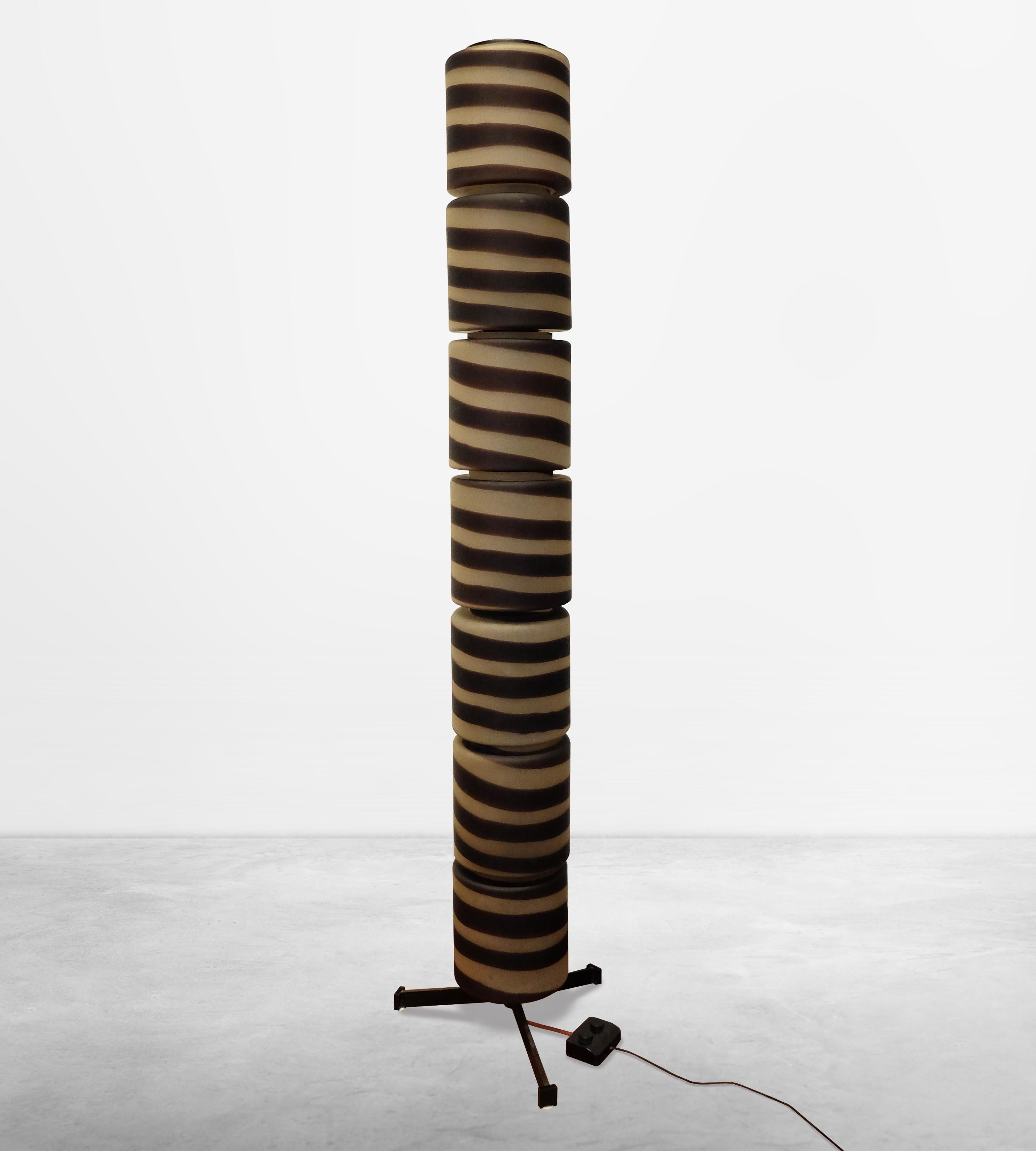 Italian Mid-Century Striped Glass Floor Lamp, circa 1950

This unique lamp consists of a central metal body and seven separate elements.  
The parts can be switched on separately from the controller in two different modes to allow partial
