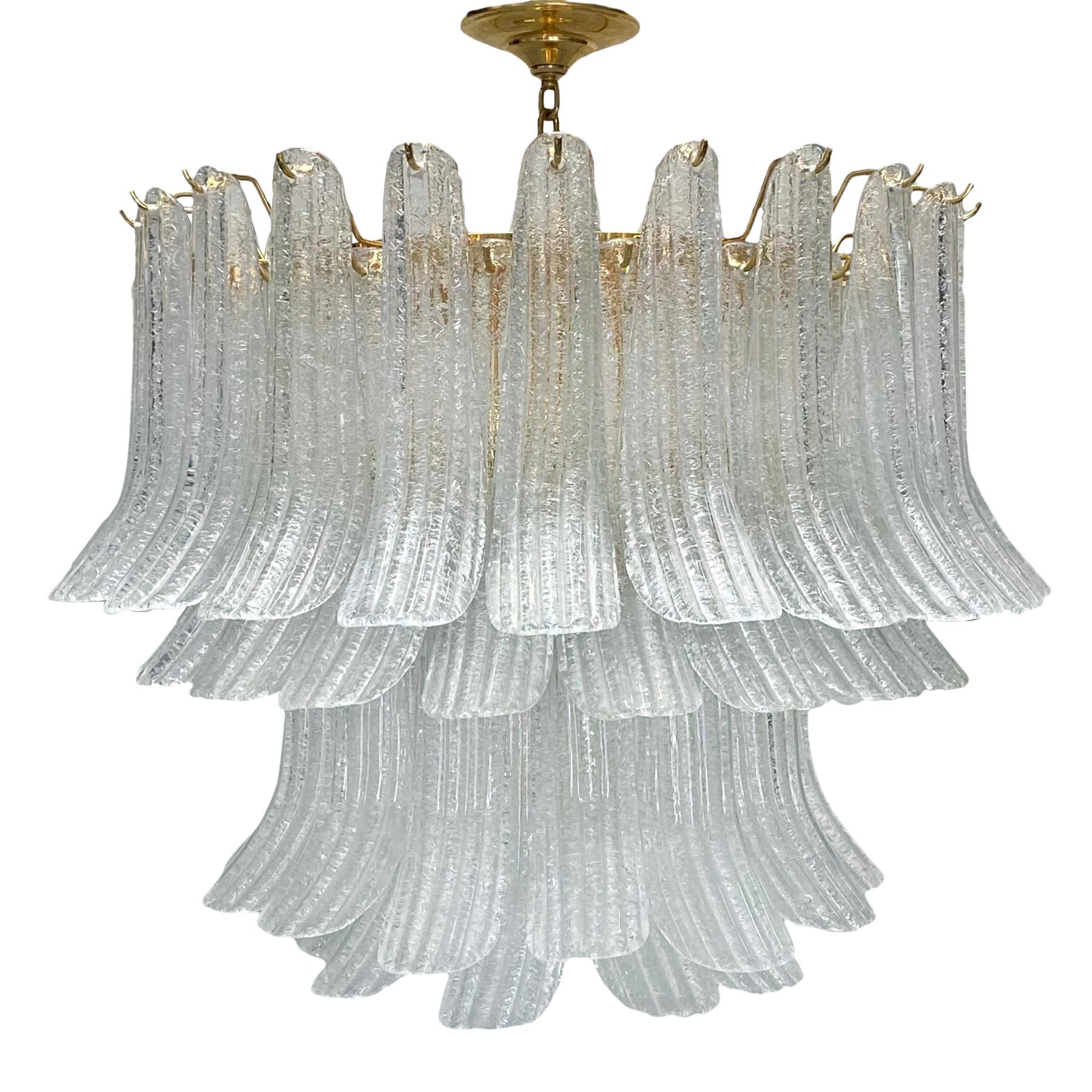 A circa 1950's Italian hand blown textured glass light fixture with nine interior lights.

Measurements:
Current Drop: 28