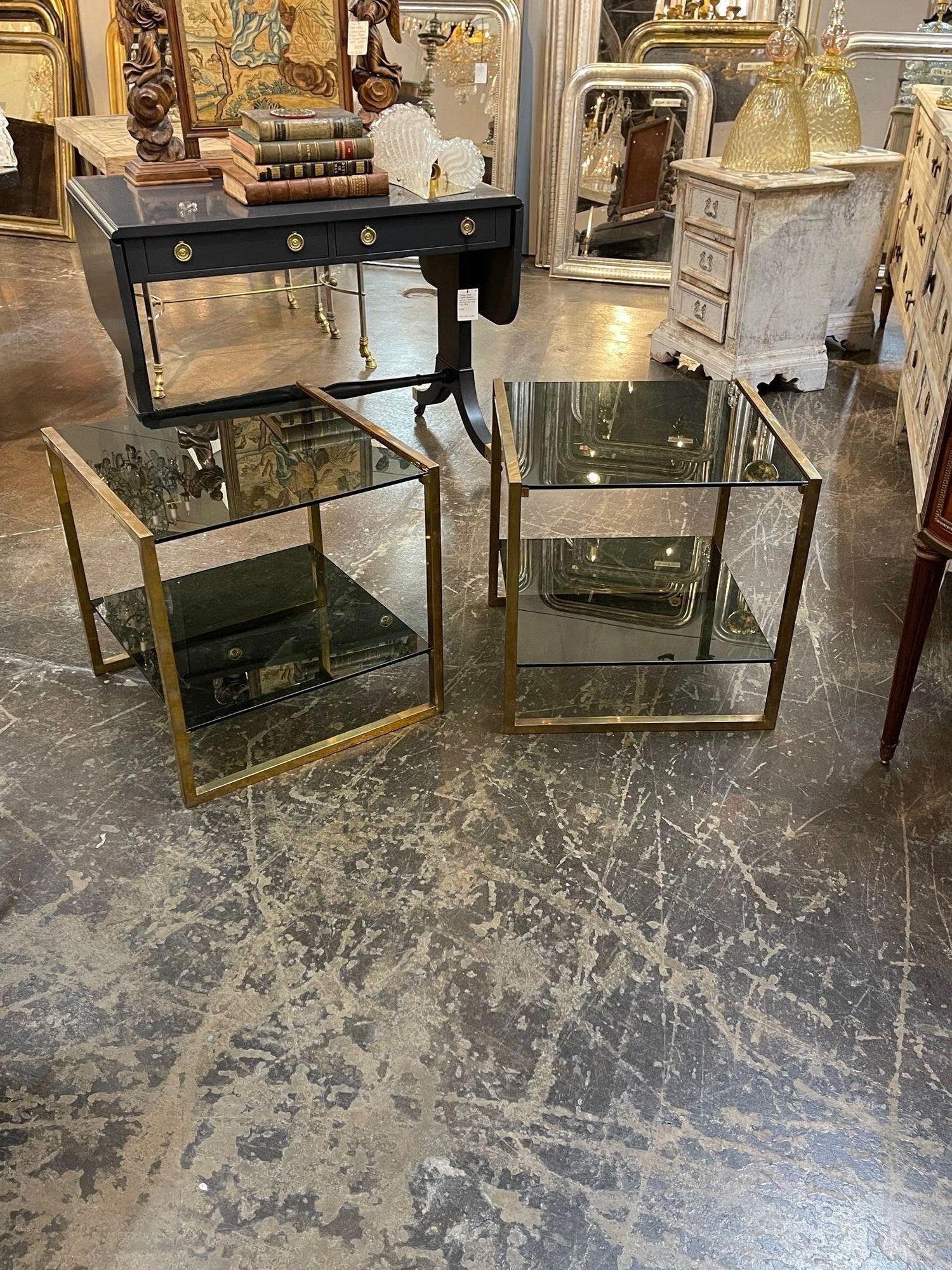 Italian mid-century brass and smoke glass side table. Circa 1960. Perfect for today's transitional designs!