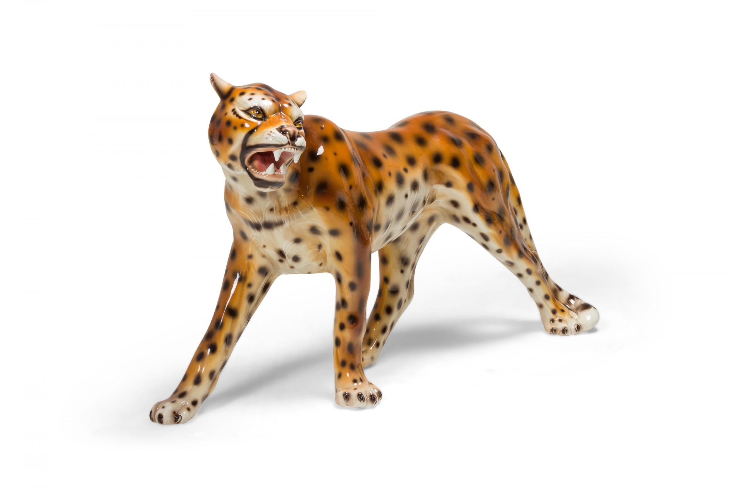 Italian Mid-Century porcelain sculpture of a leopard, mid-stride, with open mouth. (manner of Capodimonte).
 