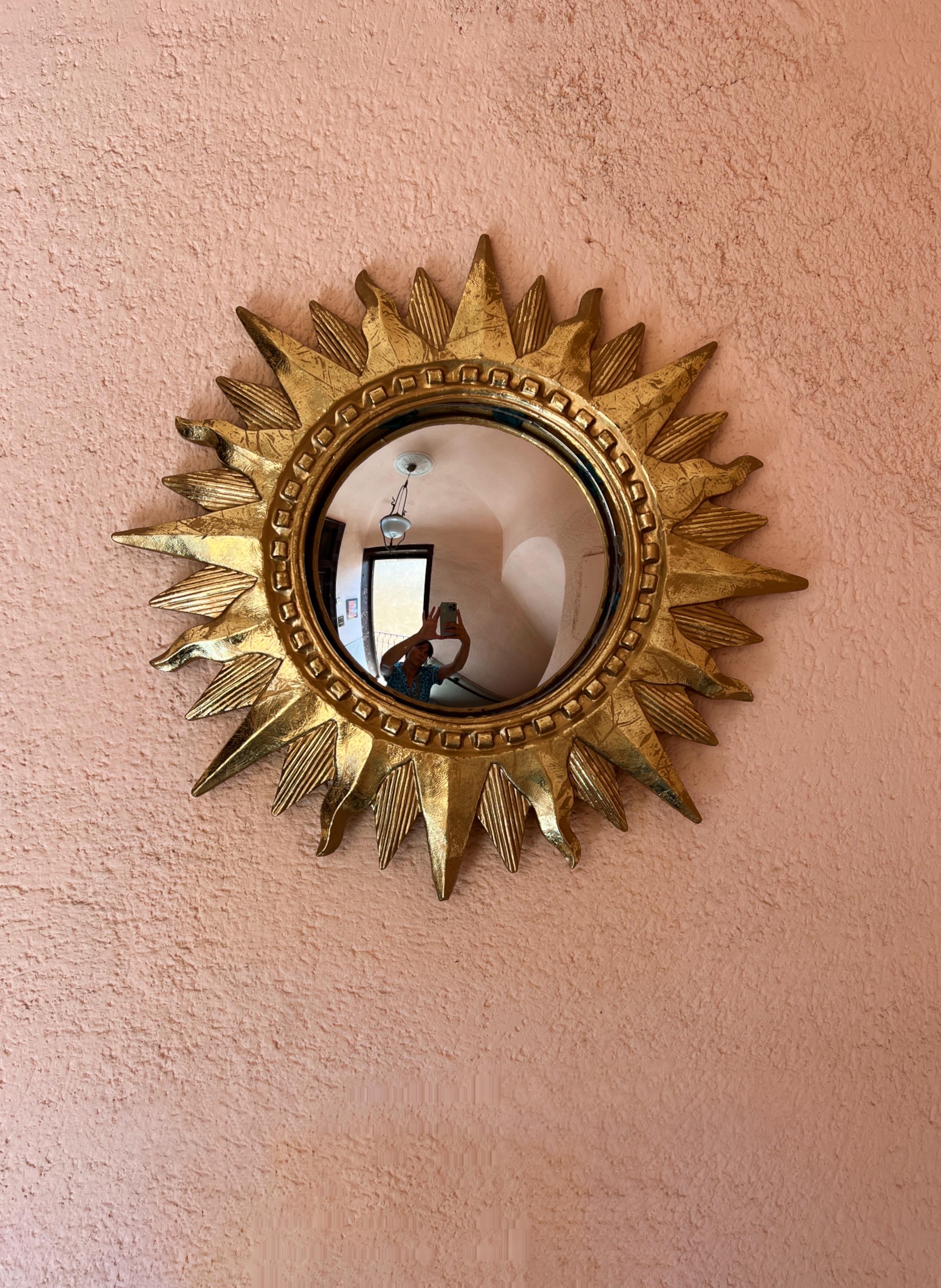 It's not just a mirror; it's a statement piece, a conversation starter, and an instant focal point in any room.

Round Sun Wooden Mirror - a true masterpiece that shines like a precious gem on your wall. 

Crafted with care around the 1970s. The