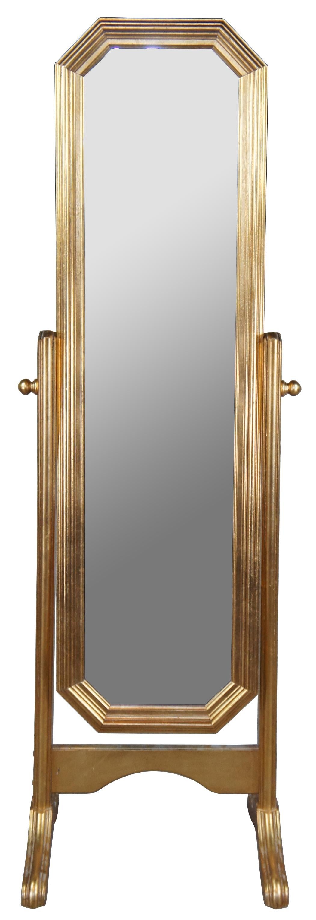 Mid Century Hollywood Regency freestanding bedroom dressing mirror. Elongated octagon form featuring a beveled mirror with gold gilt frame and adjustable angle base. Marked F. Made in Italy.

Measures: 19