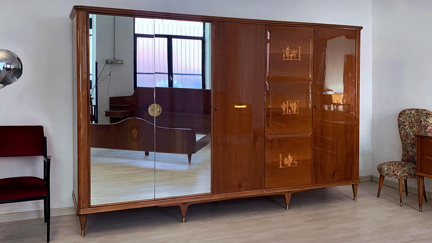 For your consideration this stylish Italian bedroom suite of the 1950s, composed by Chest of drawers with mirror and Armoire 5 doors with mirrors, both attributed to the design of Paolo Buffa.

Both items have the structures made of a gorgeous