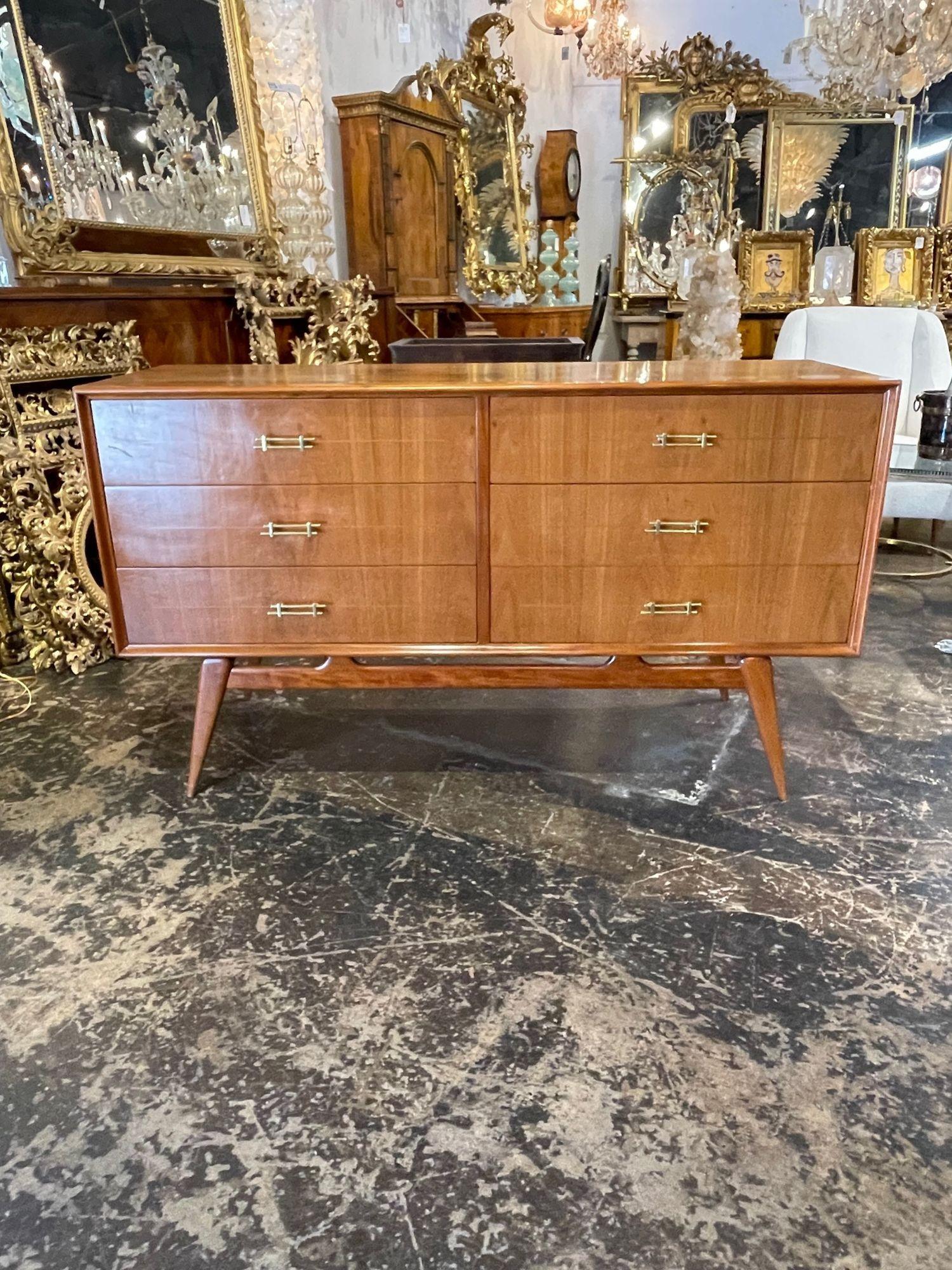 Handsome Italian mid-century inlaid walnut dresser after Marco Zanuso. This piece has beautiful wood finish, nice clean lines and brass hardware. Perfect for a modern home!.