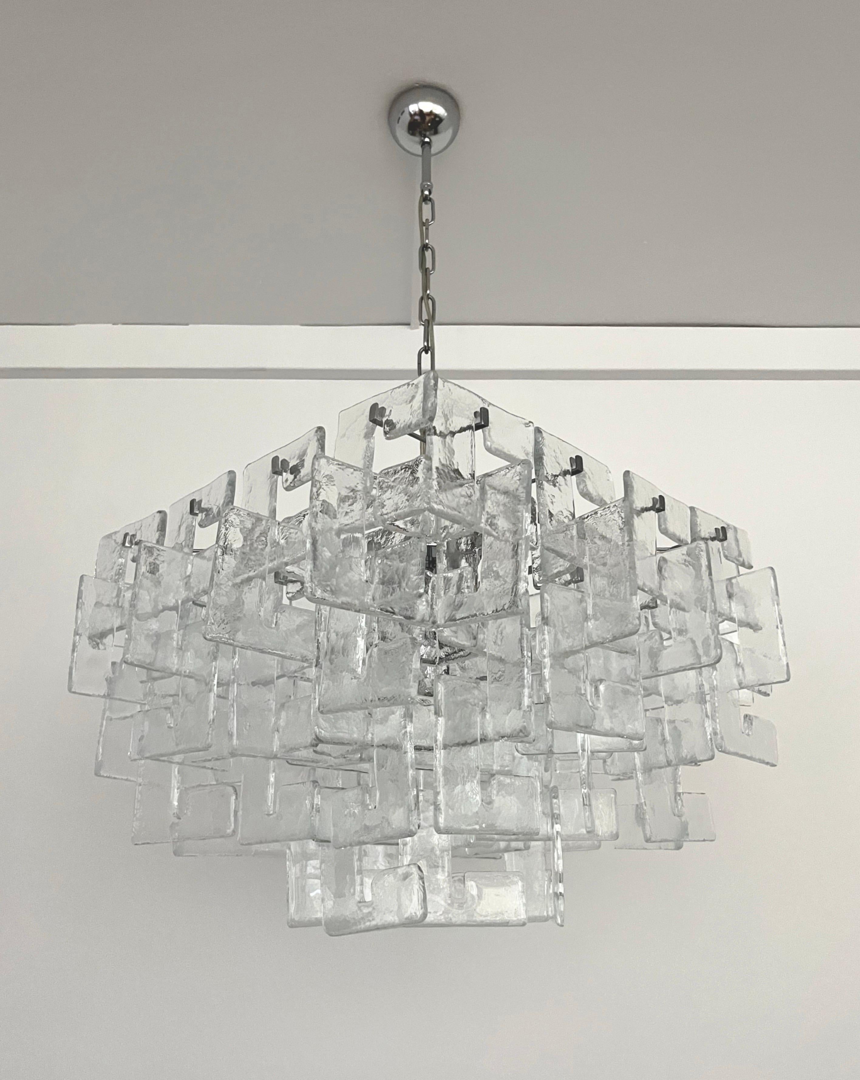 Beauty and stunning Interlocking Murano glass Chandelier by Carlo Nason for Mazzega. This Chandelier was made during the 1970s in Italy. 
Mazzega lie in the noble Venetian glassworking tradition; the firm was founded Angelo Vittorio Mazzega in