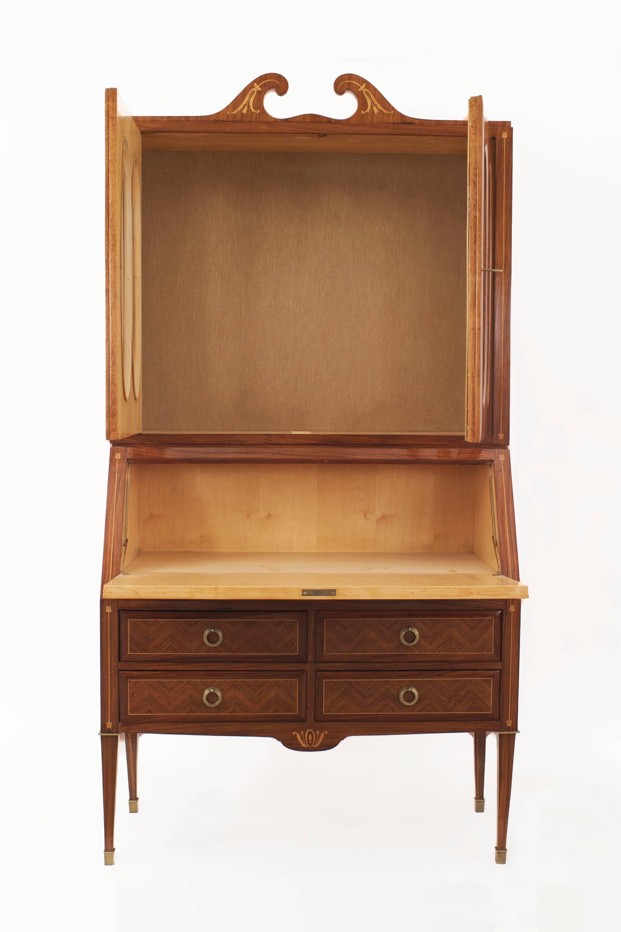 Italian Mid-Century kingwood and floral inlaid trimmed secretary cabinet with 4 oval shaped glass panel doors over a slant front desk with drawers and bronze trim (Attributed to PAOLO BUFFA)
