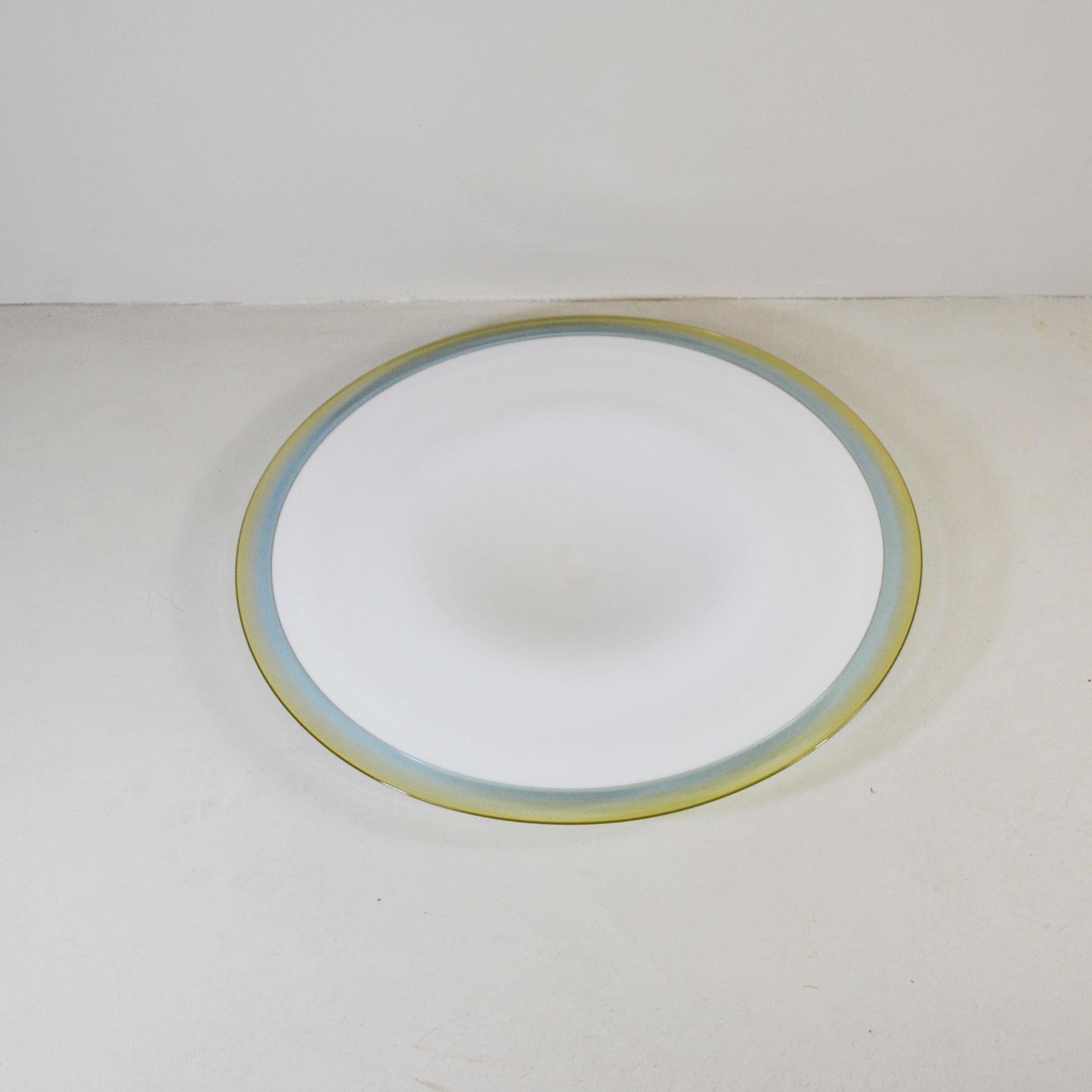 Italian midcentury large glass dishe from the 1960s. The plate is in white enamel glass in the center and colored in its circumference.