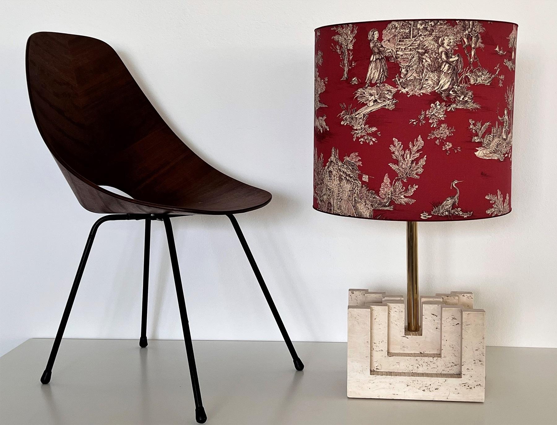 Gorgeous table lamp made of solid large Travertine marble base with custom made lampshade of big dimension.
The lamp is hand-crafted in Italy of the 1970s and in very good condition.
The lampshade is not included but only to show which kind of shape