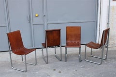 Chaises italiennes du milieu du siècle en cuir cognac structure d'acier design minimaliste 1960