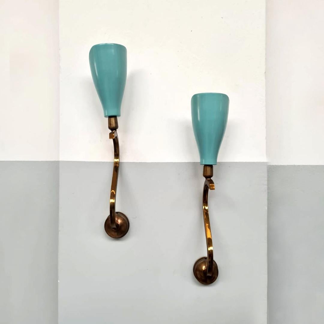 Italian midcentury light-blue metal and brass sconces by Arredoluce, 1950s
Glazed sconces with original light blue color and square section curved brass structure.
Produced by Arredoluce, Monza, 1950s
Excellent condition, marked on the