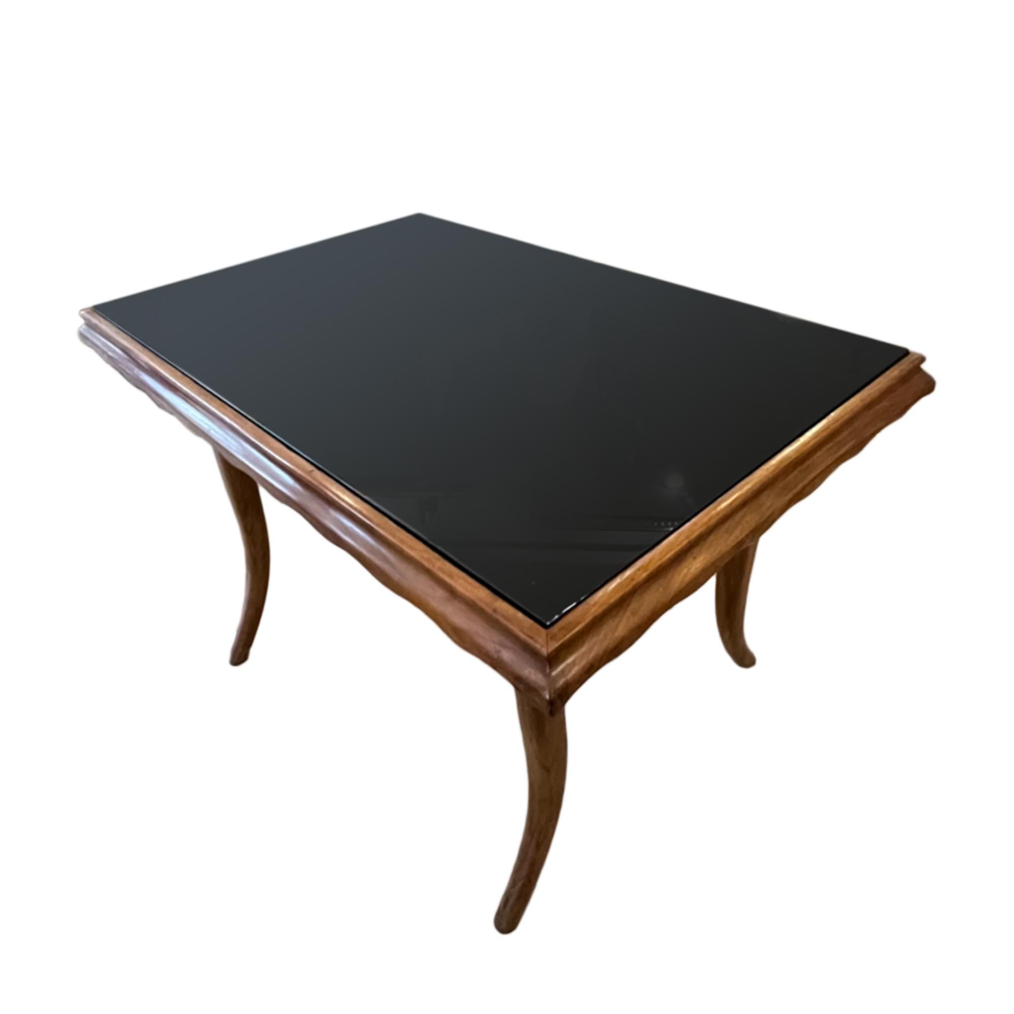 A good sized mid-century occasional table made from fruit wood with a black glass top. 

Perfect as a smaller coffee table, or a single side table. 

Simple elegant design.

Made in Italy.