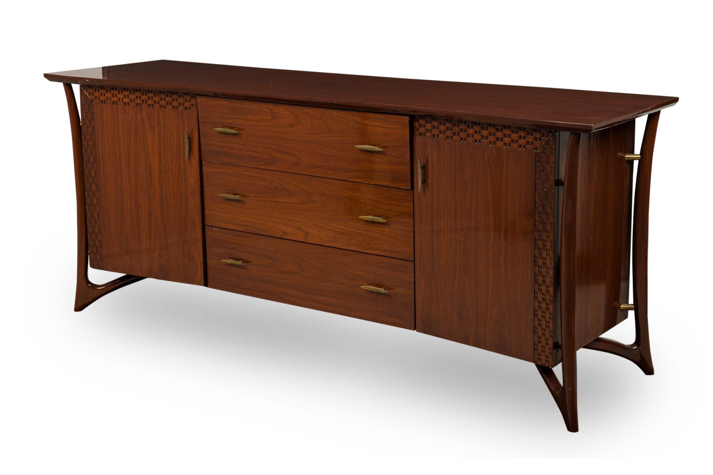 Italian Mid-Century rosewood sideboard with 2 side doors having a carved woven border centering 3 drawers with brass handles and trim (att: LUCIANO FRIGERIO)
