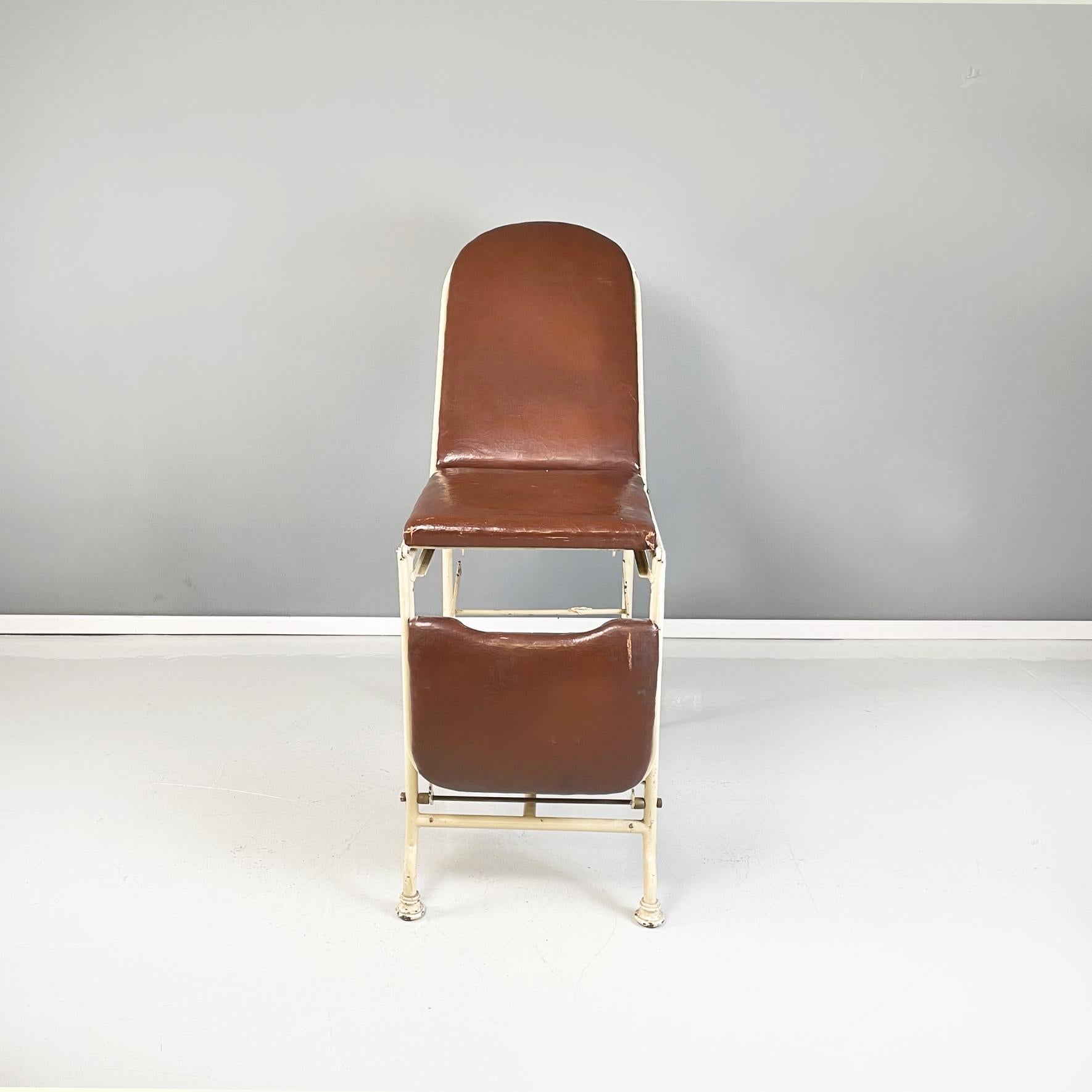 Italian mid-century Medical laboratory bed brown leather and white metal, 1940s
Medical laboratory bed with cream white painted metal structure. The backrest, footrest and seat are padded and covered in brown leather. The backrest, like the