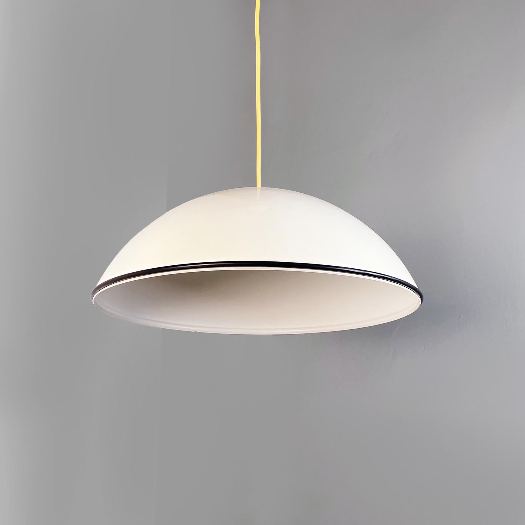 Italian mid-century metal Suspension lamp Relemme by Castiglioni for Flos, 1970s
Iconic suspension lamp mod. Relemme with hemispherical lampshade in white enamelled aluminium, equipped with a silver dome reflection bulb. The lower edge of the