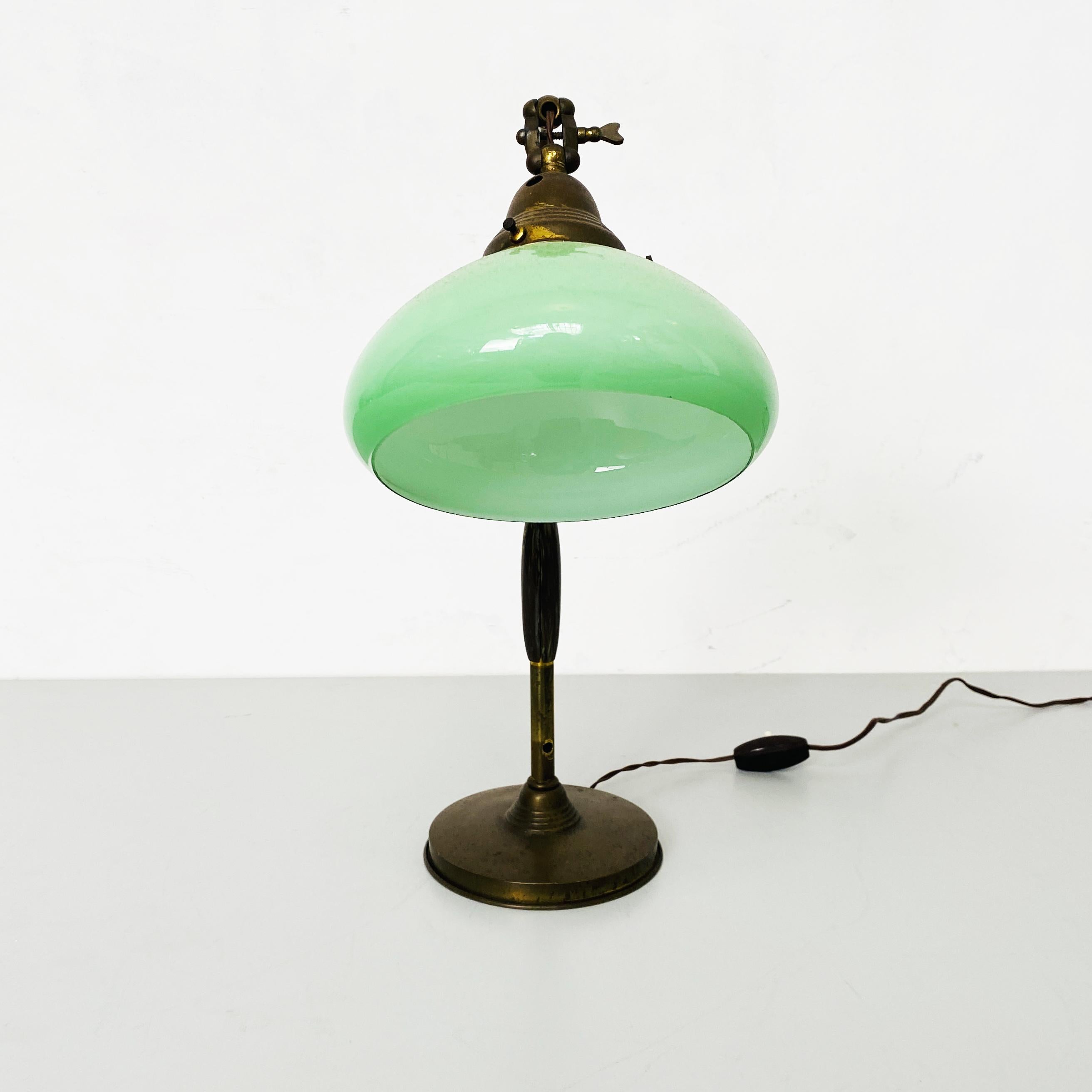 Italian Art Deco Ministerial table lamp in metal, green glass and bakelite, 1930s
Ministerial lamp with metal structure and bakelite detail, adjustable lampshade in original green glass.
1930s
Good conditions.
Measures in cm 30x15x43h.