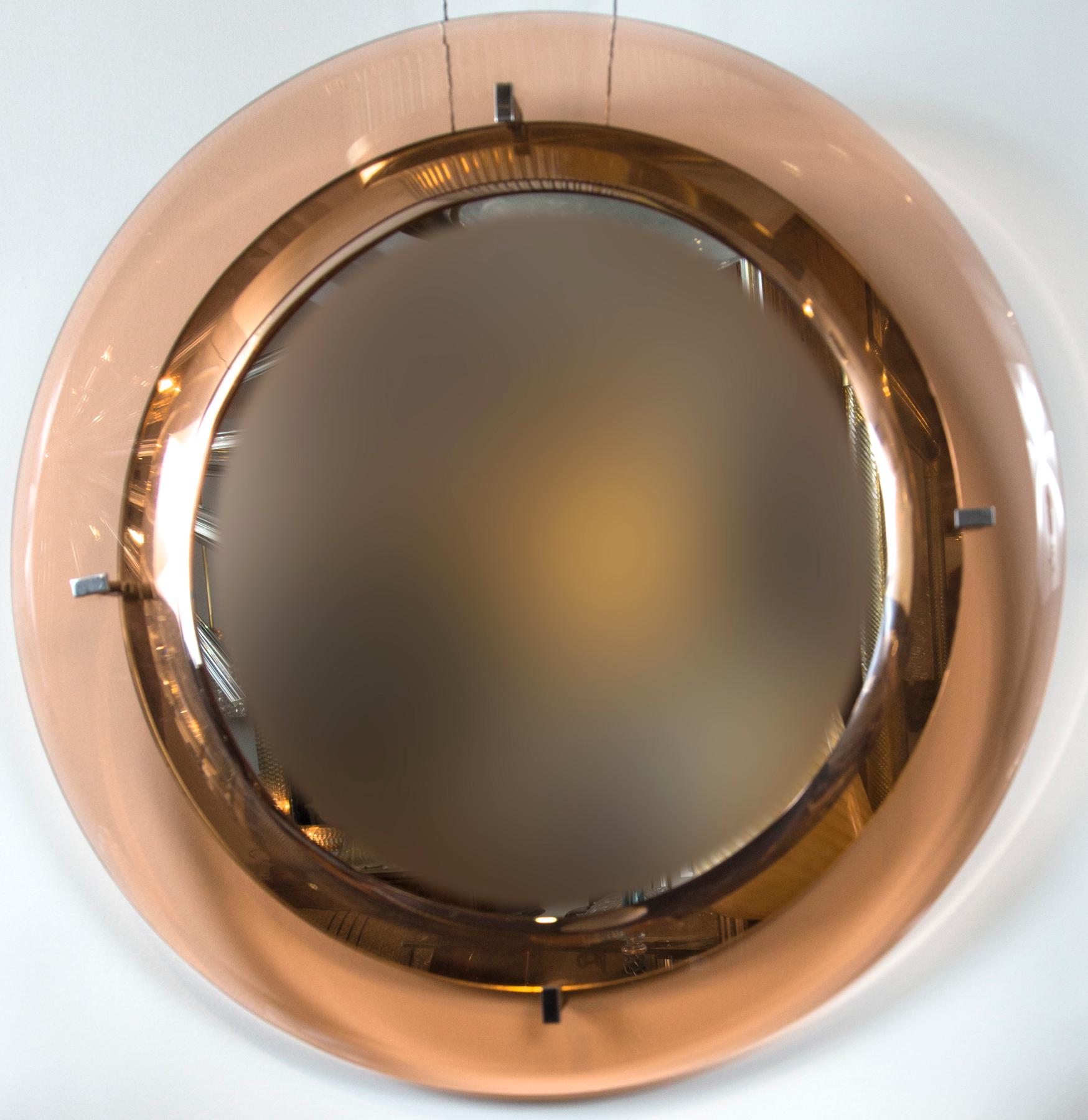 Gorgeous circular salmon colored floating crystal beveled glass frame mirror with original looking glass by Cristal Arte.
 
  
