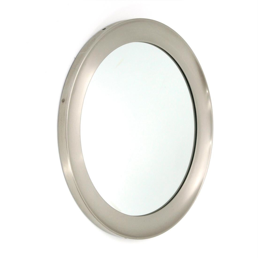 Mirror produced by Artemide in the 1960s on a project by Sergio Mazza.
Circular frame in brushed aluminum.
Back in black painted metal.
Circular mirror.
Good general conditions, some signs and lines due to normal use over time.

Dimensions: