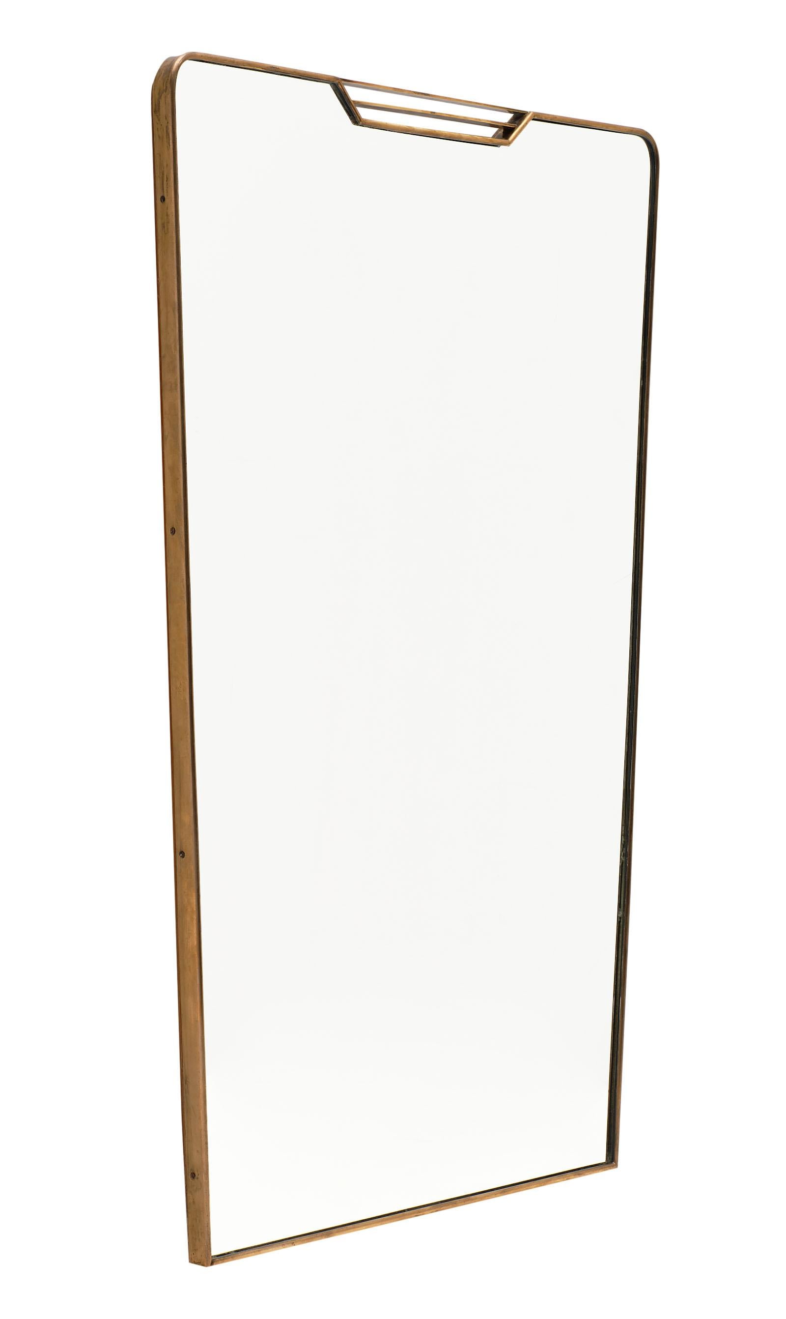 Midcentury Italian mirror in the style of Paolo Buffa. This vintage piece is all original, with a brass structure and tapered shape. A great design!