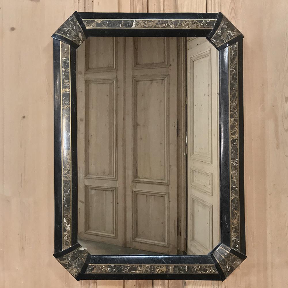 Italian midcentury mirror with inlaid marble frame presents a luxurious facade rendered by talented Italian masons in the spirit of the Pietra Dura traditions.
Can also be mounted horizontally!
circa 1950s
Measures 33.5 H x 24 W x 1.5 D.