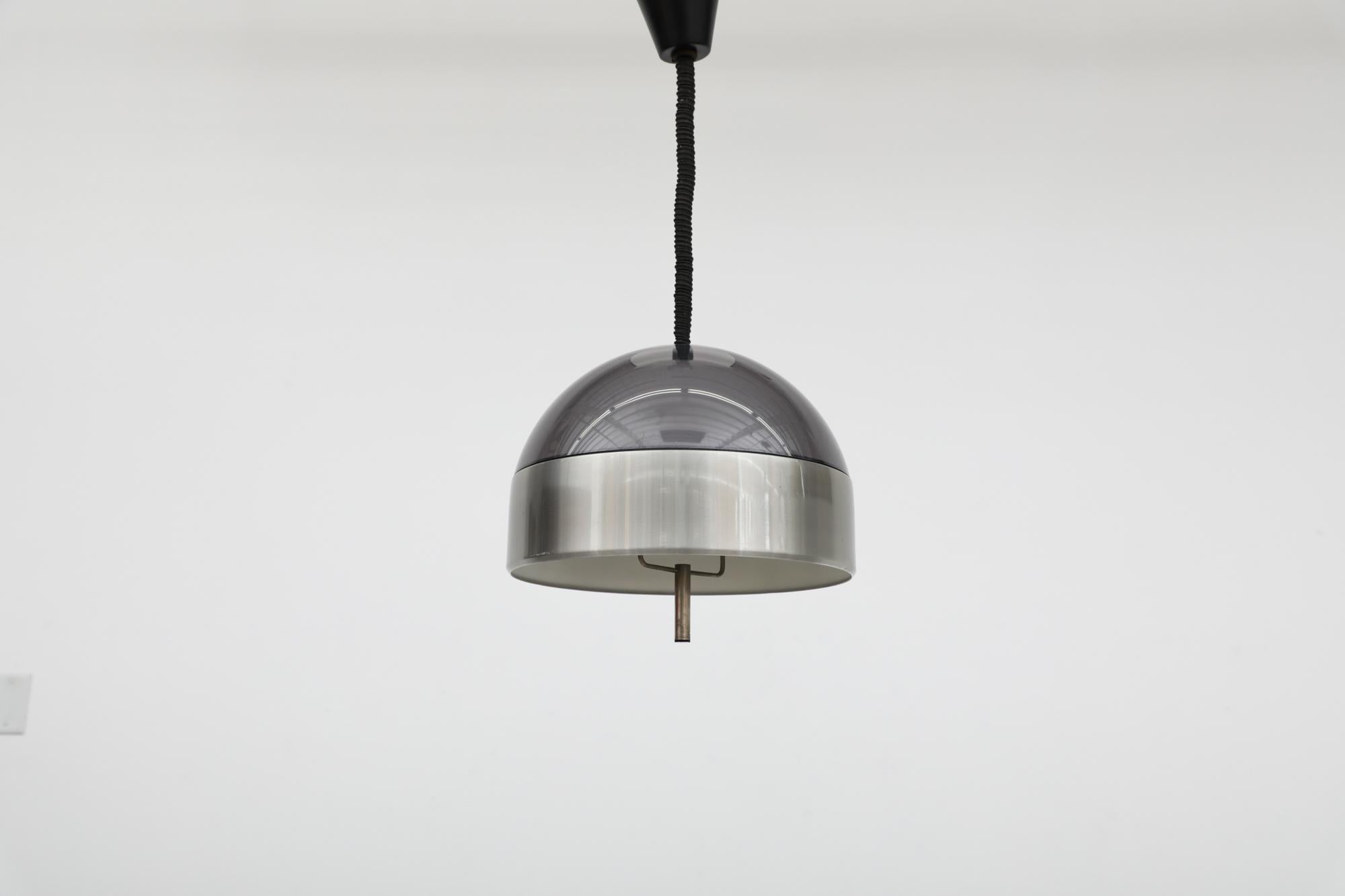 Amazing adjustable height Italian MOD 1970's dome pendant. A smoked plexiglass shell with  brushed aluminum belt and metal handle. In original condition with black canopy and some  wear consistent with age and use.