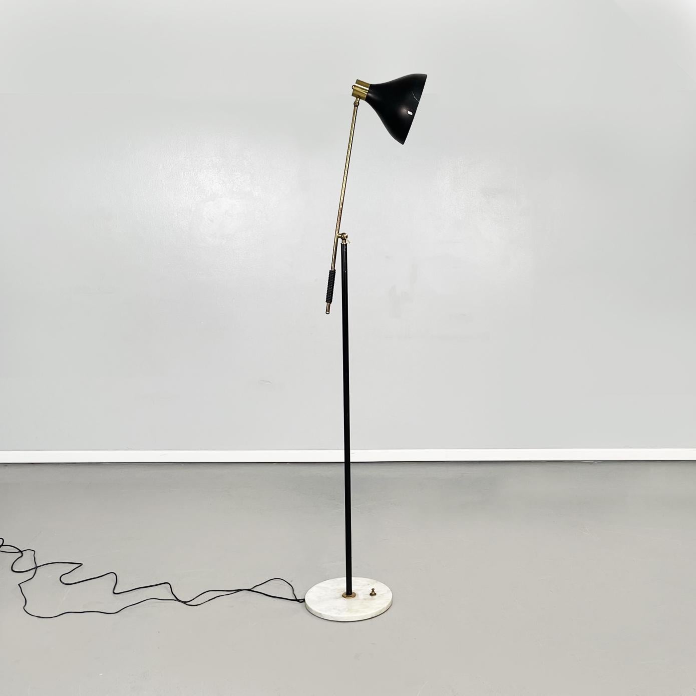 Italian Mid-Century Modern Adjustable brass metal floor lamp by Stilux, 1950s
Adjustable floor lamp with round marble base and structure in tubular of brass and metal. The lampshade is in black painted metal. The structure is composed with a brass