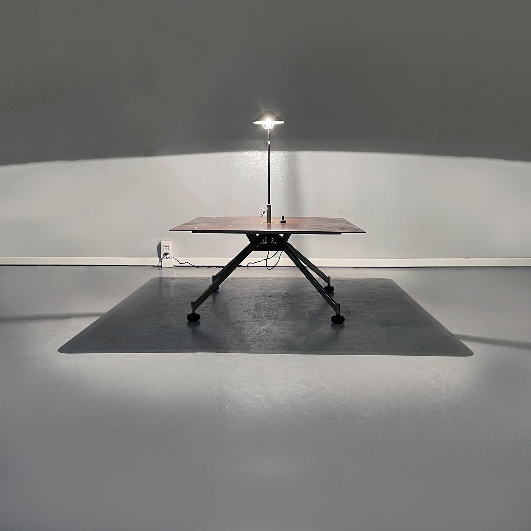 Italian Mid-Century Modern Apocalisse now coffee table by Carlo Forcolini, 1980s.
Apocalisse now square coffee table in iron with legs in pyramid structure. In the center of the piano is the lamp, the height and intensity of the light of the lamp