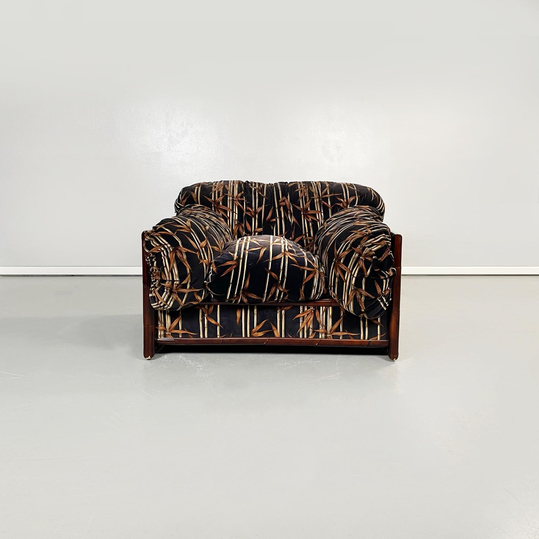 Italian mid-century modern Armchair in bamboo and fabric, 1980s
An armchair in bamboo wood and fabric with brown bamboo pattern on a black background. Exposed bamboo wood structure. The armchair is composed of a rectangular cushion as seat, two
