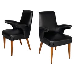 Italian mid-century modern armchairs in black leather and wood, 1960s