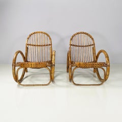 Italian mid-century modern Armchairs with armrests in curved rattan, 1960s