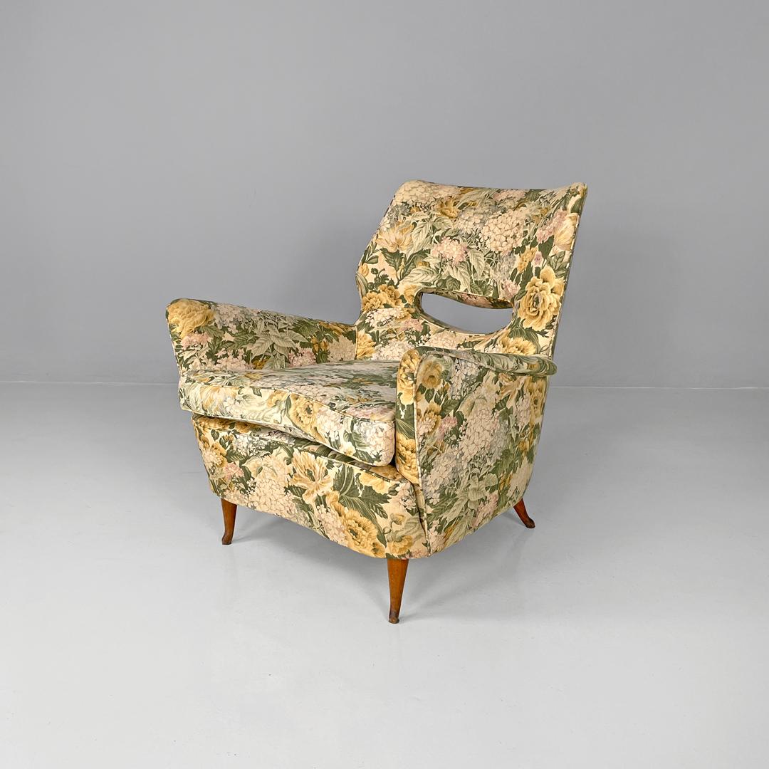 Italian mid-century modern armchairs with yellow and green floral pattern fabric, 1960s
Pair of armchairs covered in fabric with floral pattern in shades of green and yellow. The structure has curved shapes, which design the armrests and seat. On