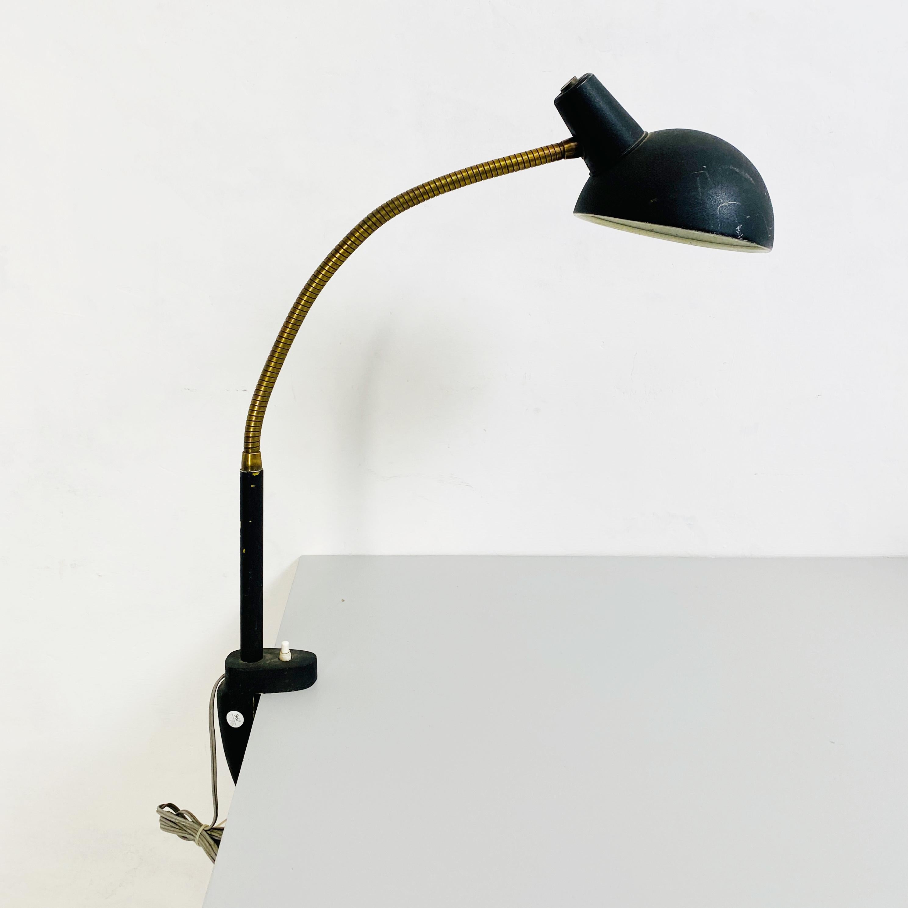 Articulated table lamp with clamp-on, 1970s
Articulated table lamp with clamp-on in black painted metal and chromed steel.

1970s.

Good conditions, with some signs.

Measurements in cm 41 x 17 x 67 H.