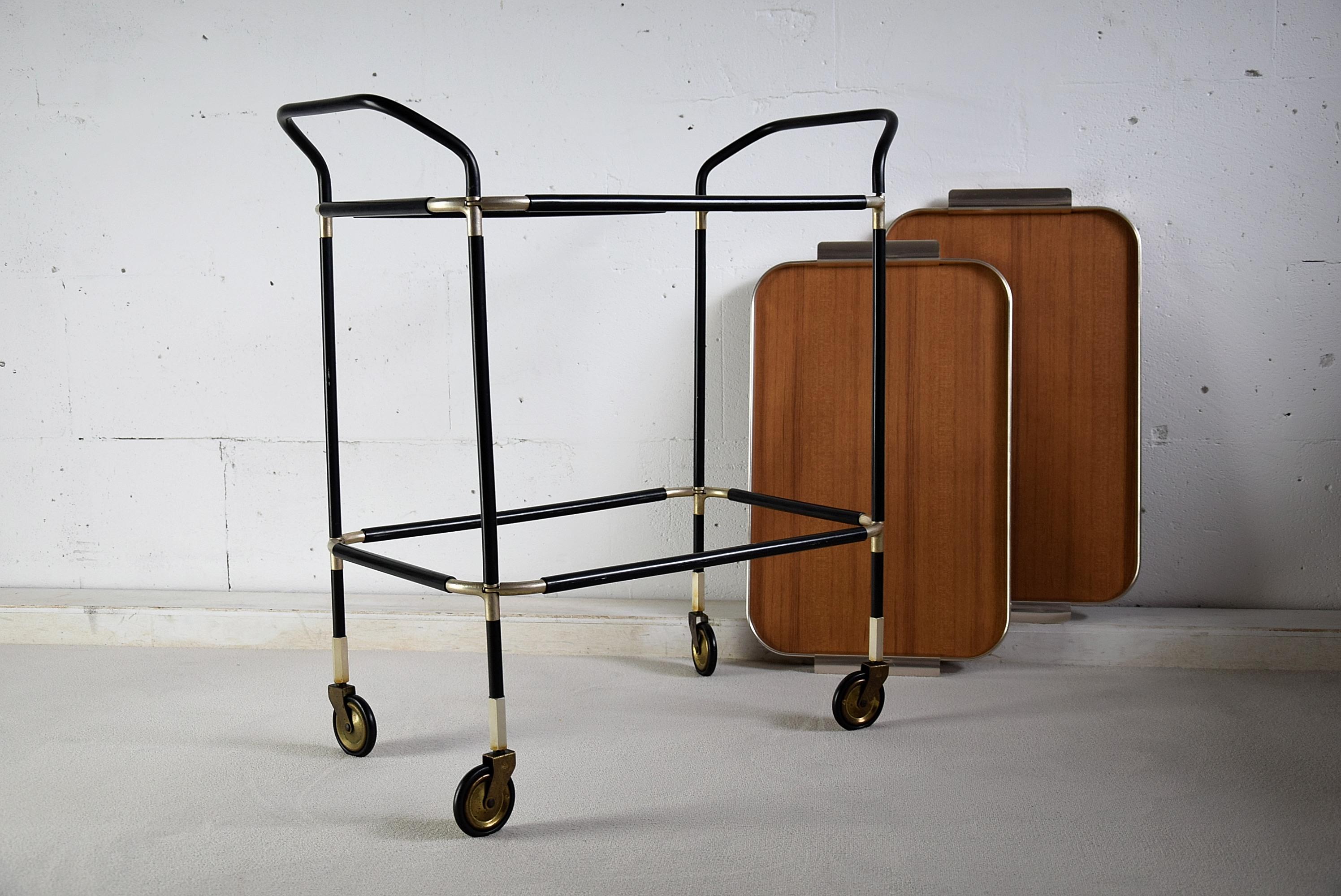 Stylish and elegant Italian 1960s bar trolley with two detachable serving trays. The trolley is in great condition as can be seen in the images.
The trolley will be shipped overseas insured in a custom made wooden crate. Cost of insured transport