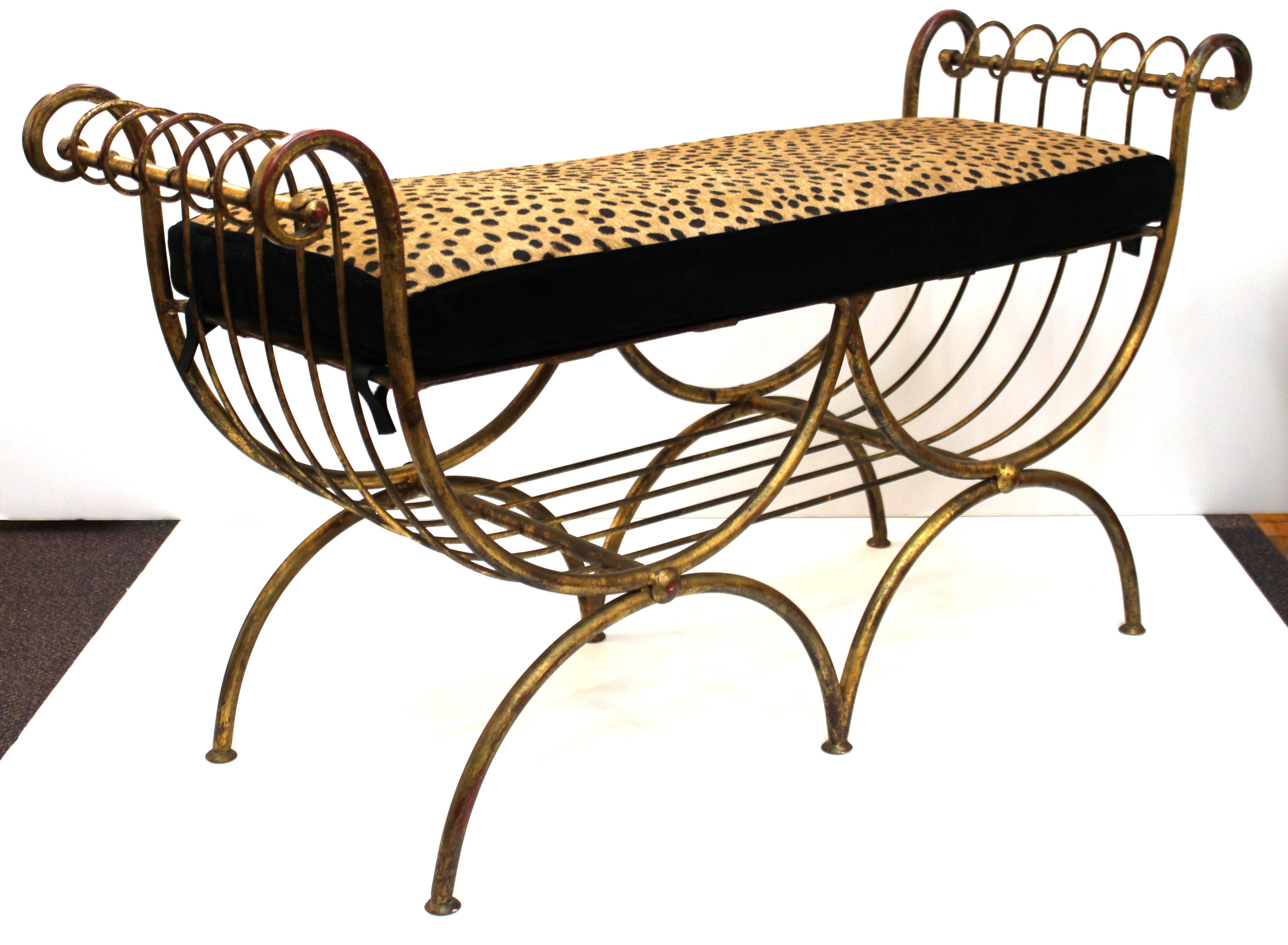 Italian Mid-Century Modern two-seat gilt iron bench, with a new seat cushion upholstered in faux leopard leather. The seat is removable. This piece dates from the 1950s and is in great vintage condition.
