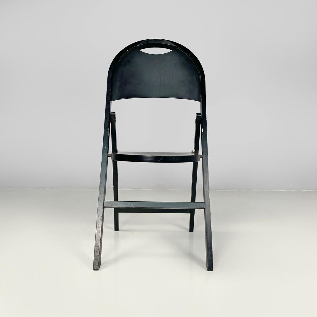Italian mid-century modern black folding chair Tric Castiglioni BBB, 1960s
Folding chair mod. Tric entirely in black painted wood. The seat and backrest are rounded. The legs are rectangular in section.
Produced in 1960s by BBB and designed by