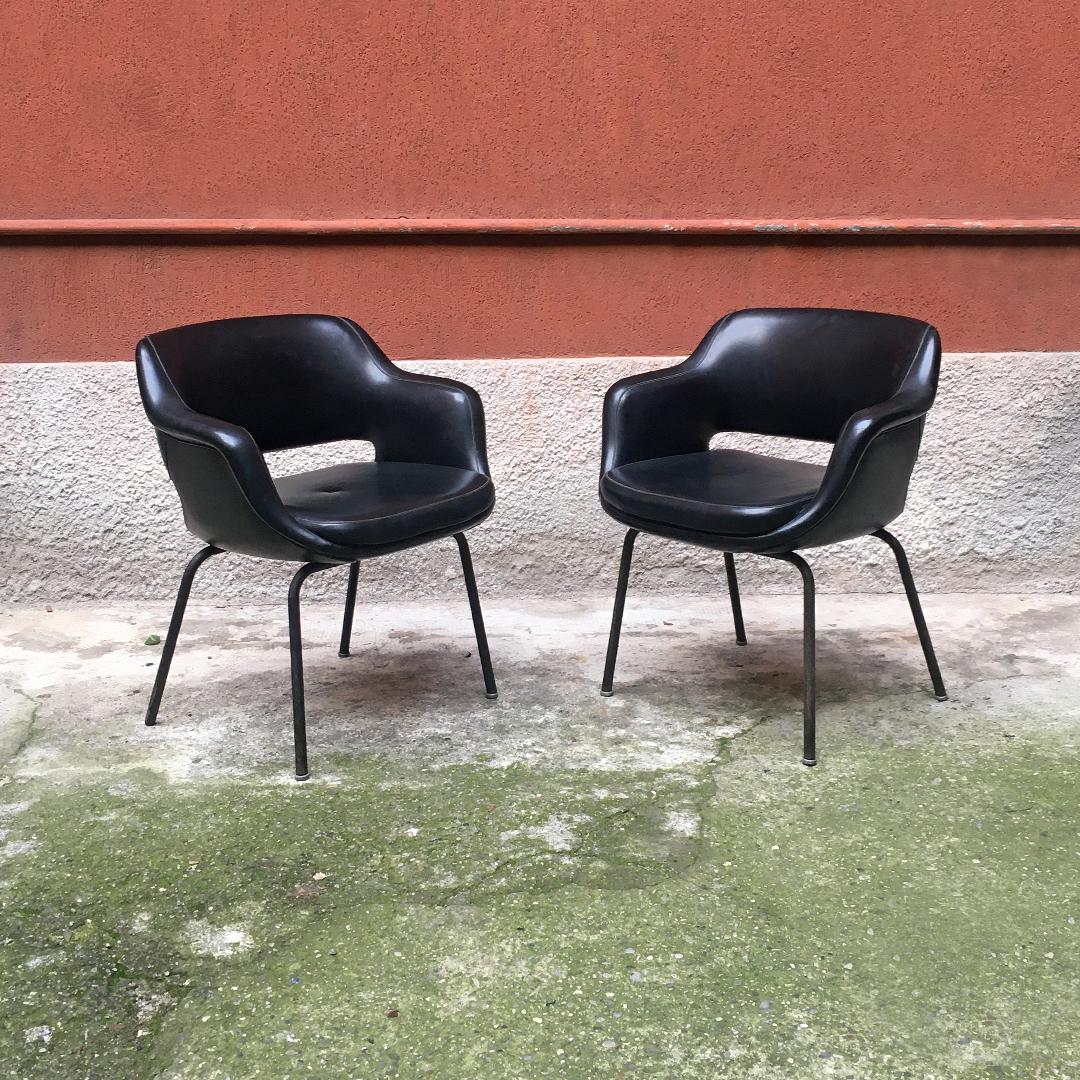 Italian Mid-Century Modern black leather armchairs by Cassina, 1970s
black leather pair of armchairs with armrests and legs in chromed steel for office and desk.
Produced by Cassina, 1970s

Original fabric and padding and almost perfect chrome