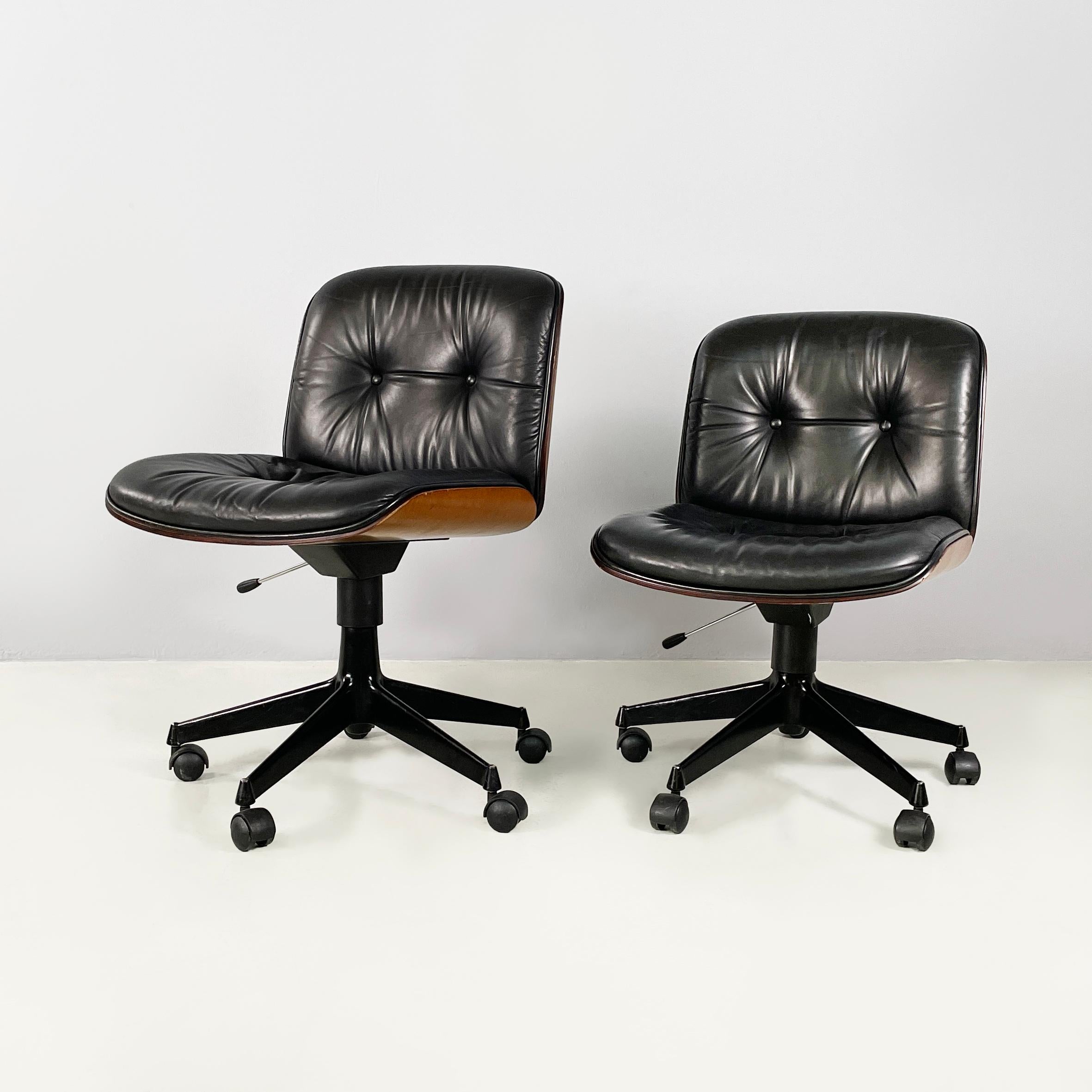 Italian mid-century modern Black leather Office chairs by Ico Parisi for MIM, 1960s
Set of 4 office chairs with padded seat and backrest covered in black leather with stitching. Seat structure in shaped wood. Seat height adjustable thanks to a lever