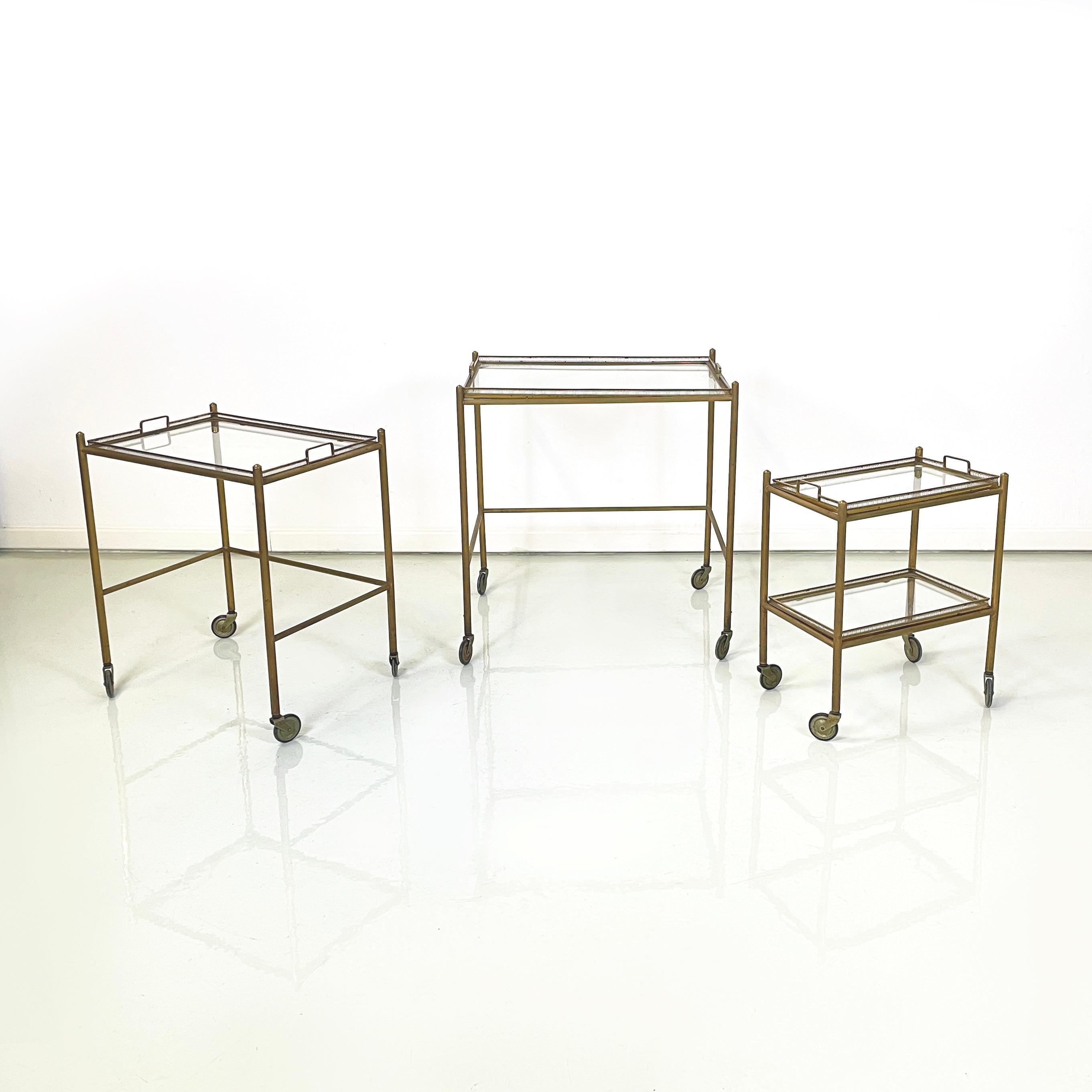 Italian mid-century modern Brass and glass carts with tray, 1960s
Set of 3 food carts with brass structure. The two larger carts have a removable tray with a finely crafted brass structure and glass top. The smaller cart has two shelves with a