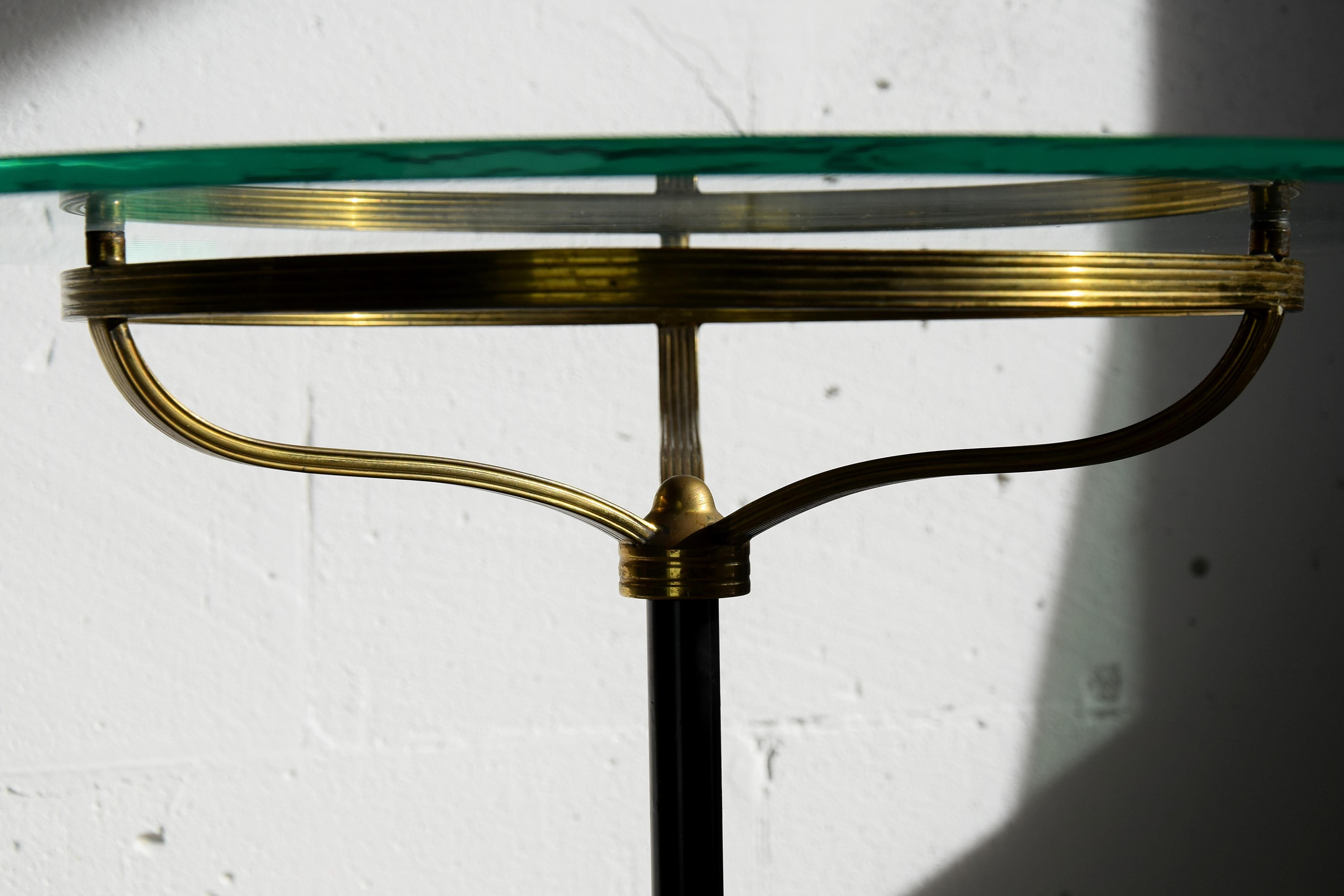 Stylish and sophisticated Italian brass and glass side table produced in the 1960's. 
This elegant tabel will be shipped disassembled. To put it back together takes 5 minutes.
The table wil be shipped insured overseas in a custom made wooden crate.
