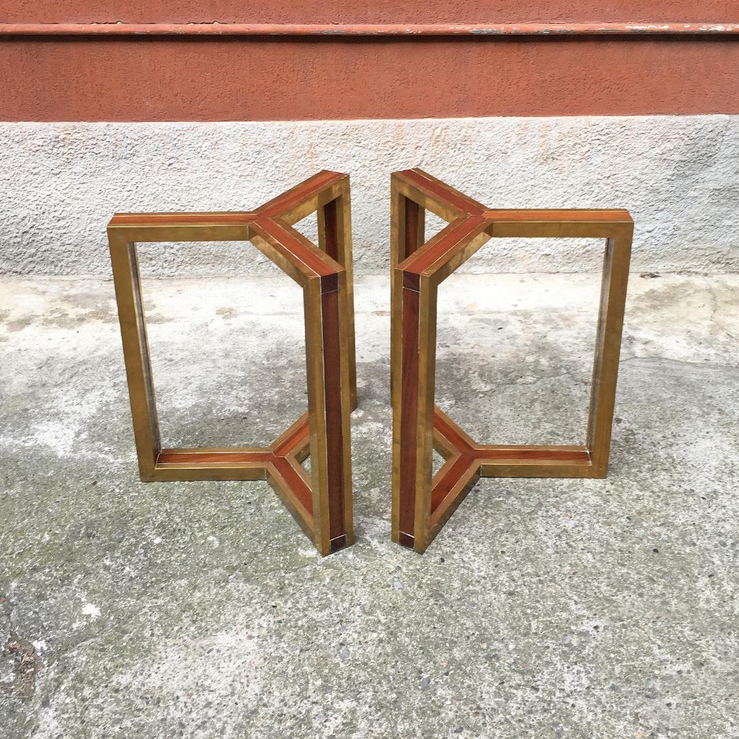 Italian mid-century modern brass and wood bases, 1980s
Pair of brass bases, for table or console, with brass structure and central wooden core.

Good general conditions.

Measures: 70 x 70 H cm.