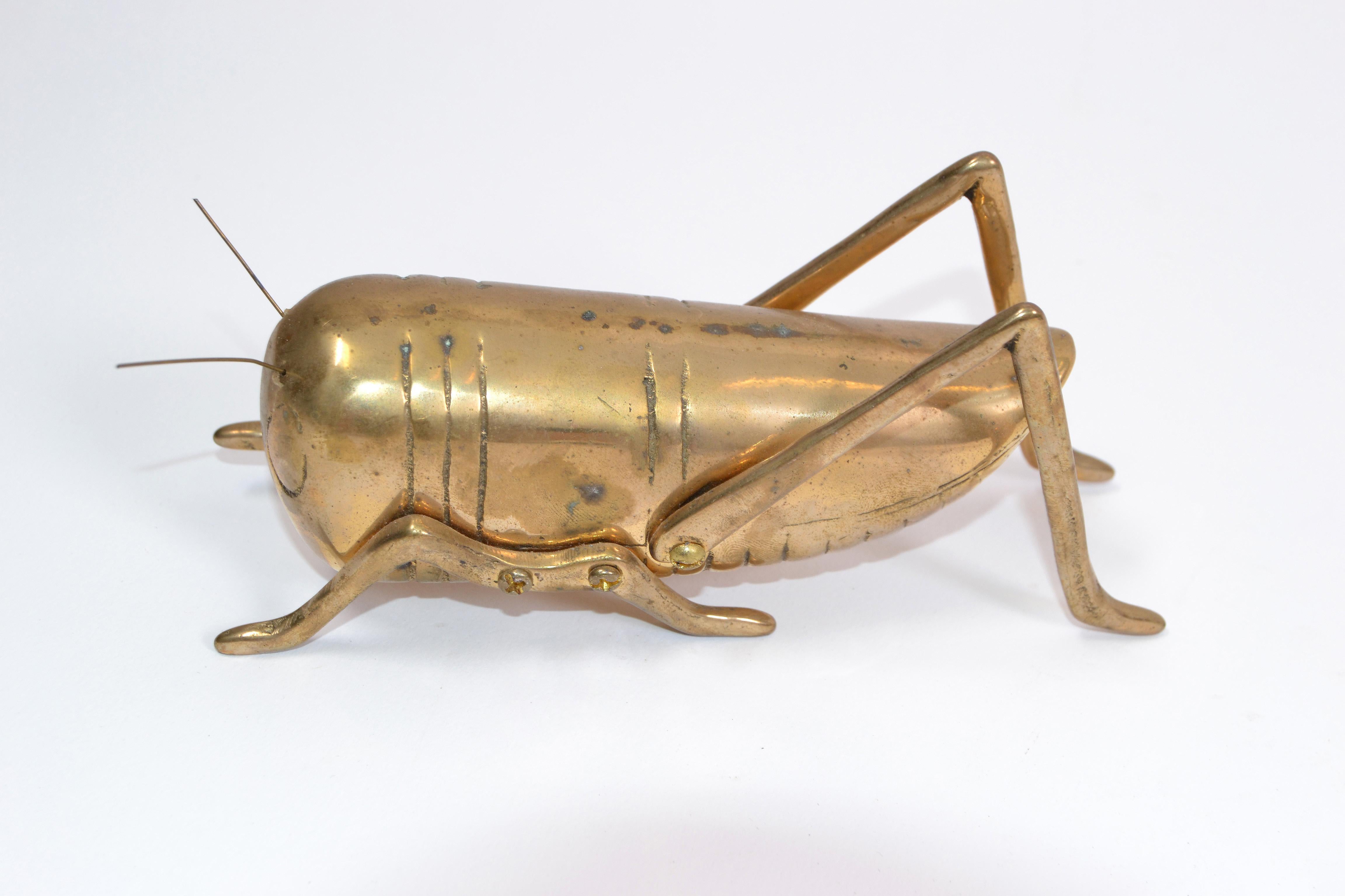 brass grasshopper figurine