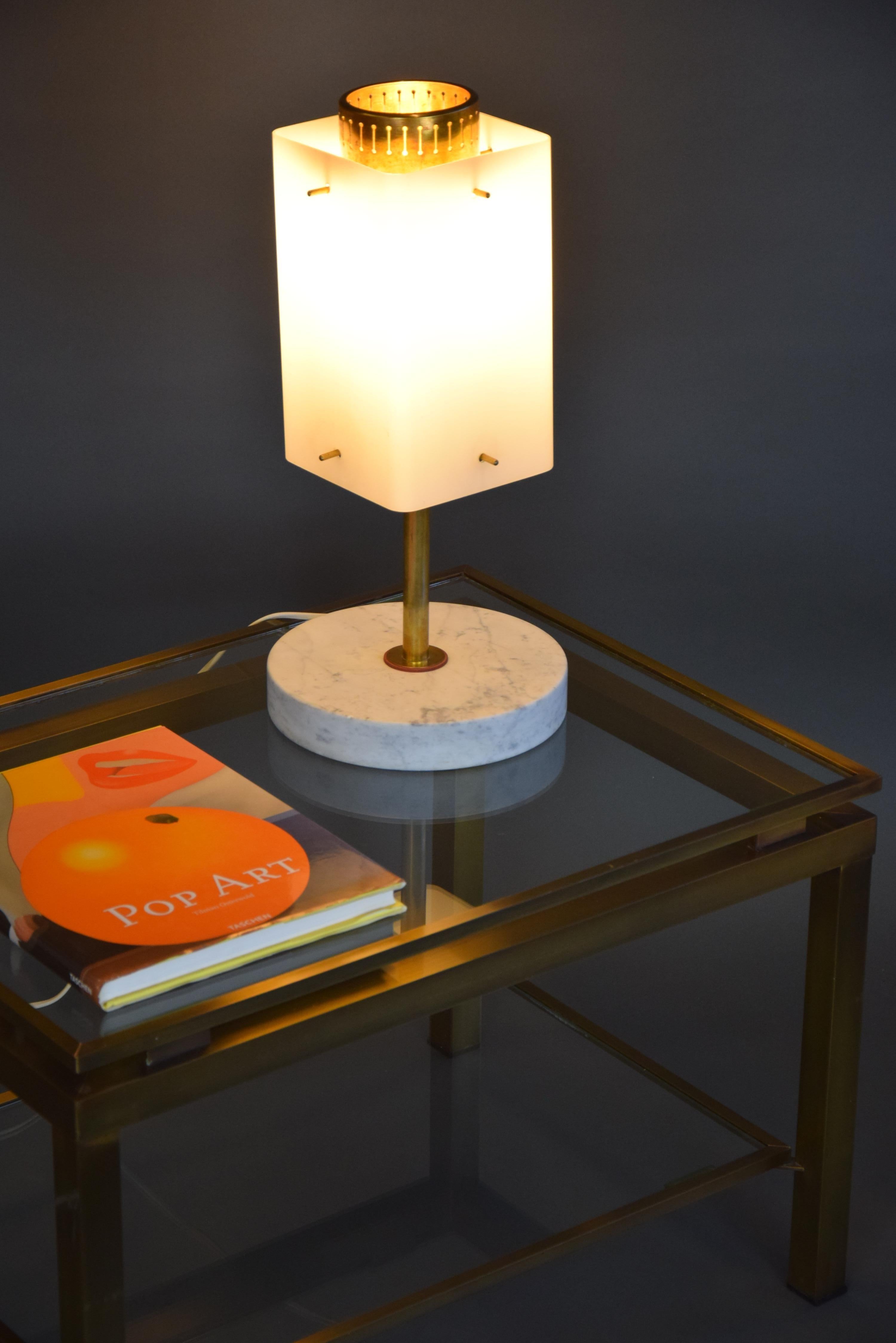 Stylish, elegant and classy Italian Mid-Century Modern opaline glass, brass and Carrera marble table lamp in great condition.
A jewel in just about every interior, living room, study or bedroom.

This beauty will be shipped by us insured overseas in