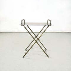 Mesa de servicio italiana de mediados de siglo con estructura de latón y tapa de cristal, años 60