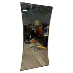 Vintage 1970s Brass Framed Hourglass Beveled Wall Mirror