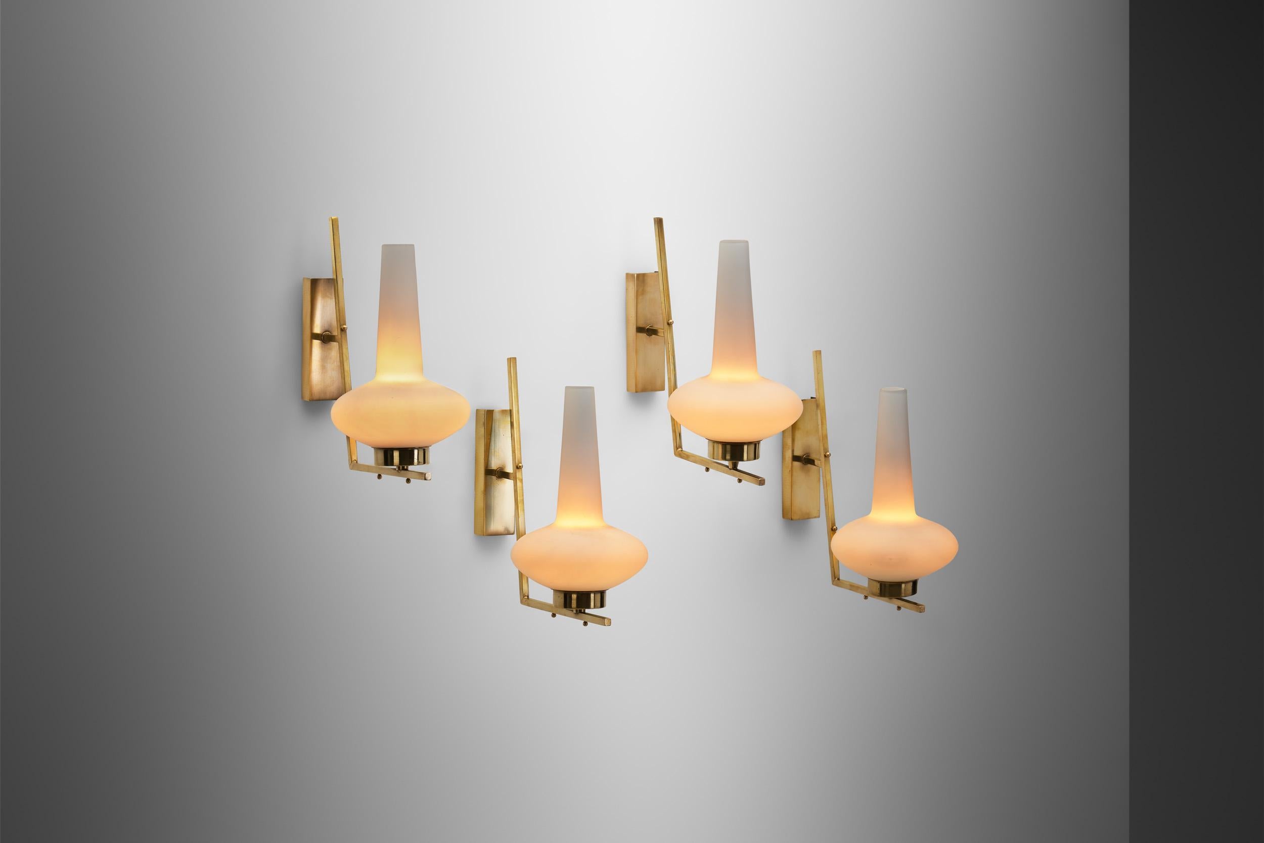 Italian mid-20th century lighting design was infinitely captivating, featuring one-of-a-kind models crafted by renowned Italian designers such as Ettore Sottsass, Gio Ponti, Gavina and other internationally esteemed names. As these wall lamps show,